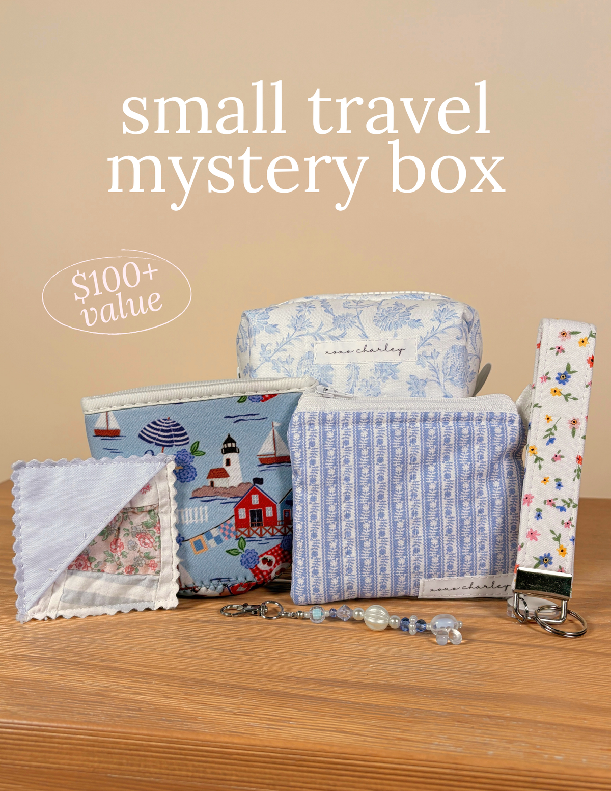 Small travel mystery box: assorted blue and multicolor fabric zip pouches with charms.