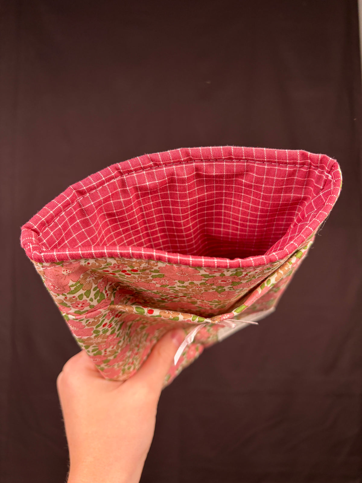Folded e-reader sleeve with floral outer and red grid inner lining