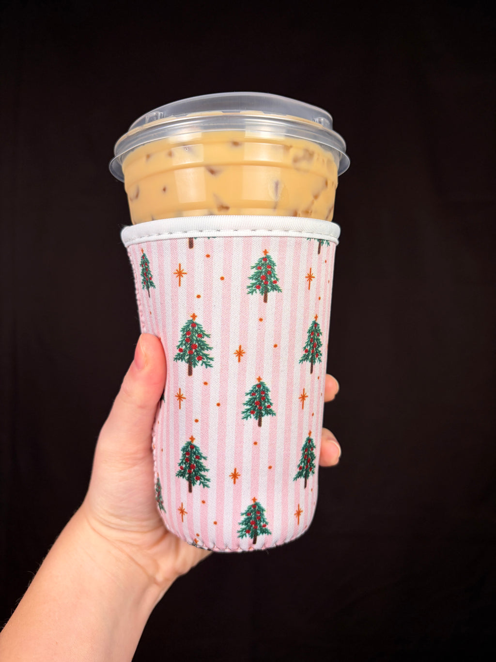 Medium pink striped cup sleeve with evergreen Christmas tree and star print