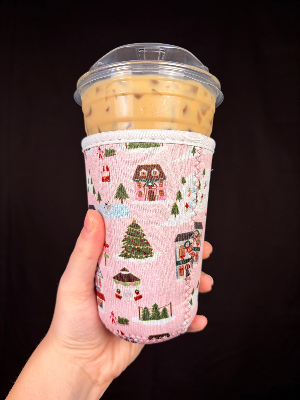 Medium pink cottage cup sleeve, front view with houses, trees, and snow icons