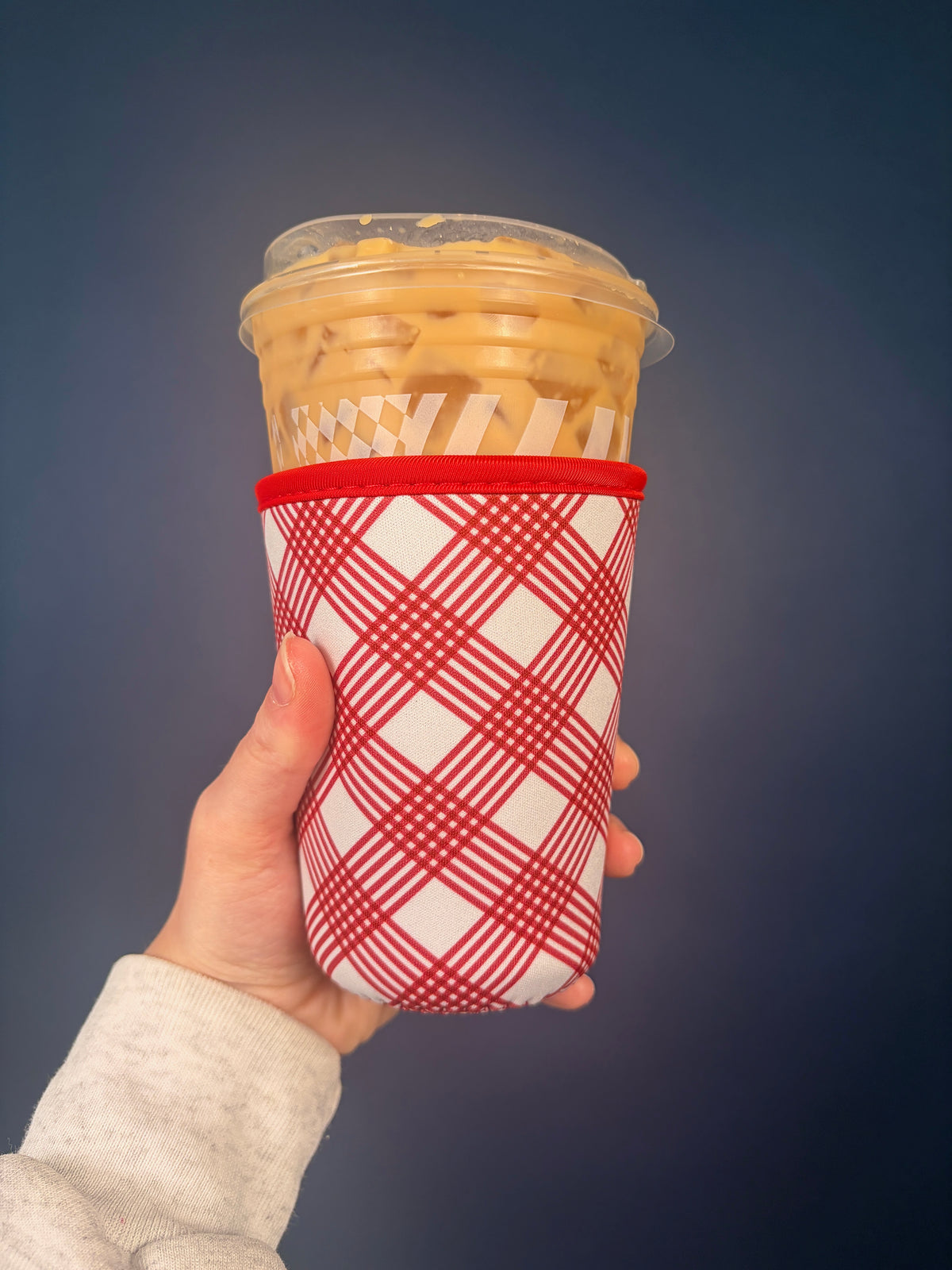 Medium cranberry cup sleeve with red and white plaid design