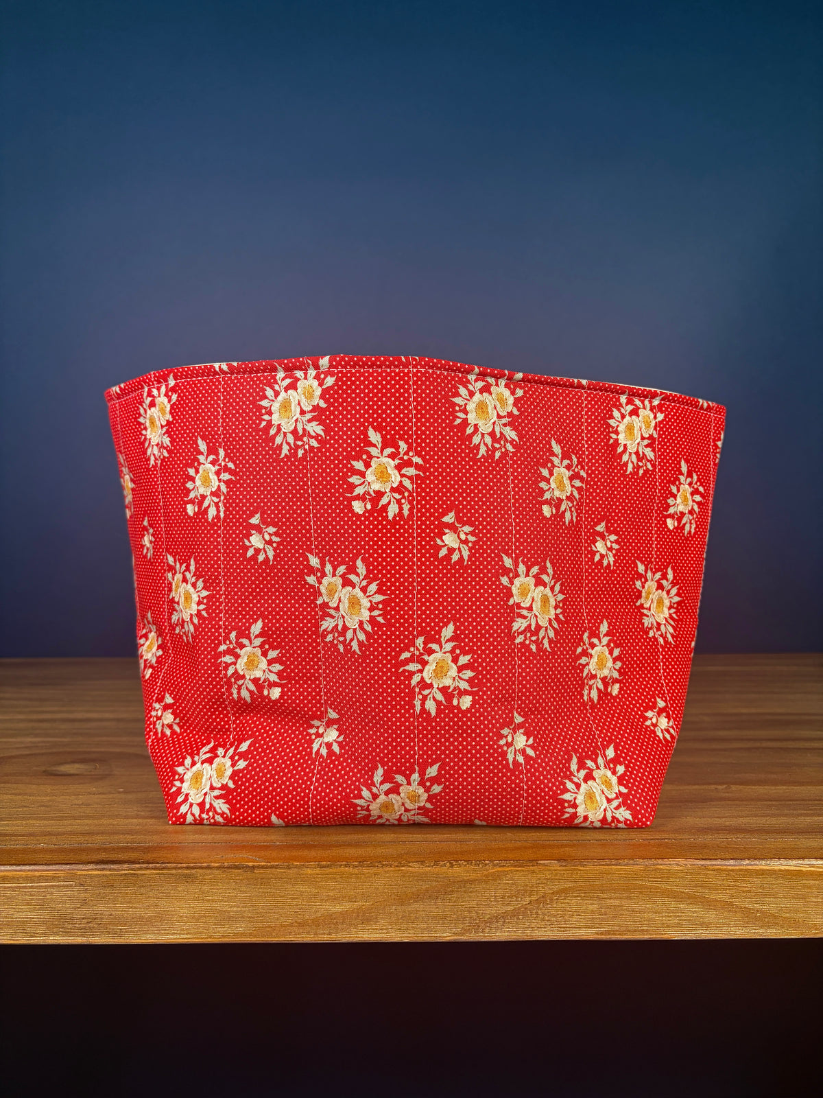 Large fabric bowl, red with white floral pattern, rounded sides