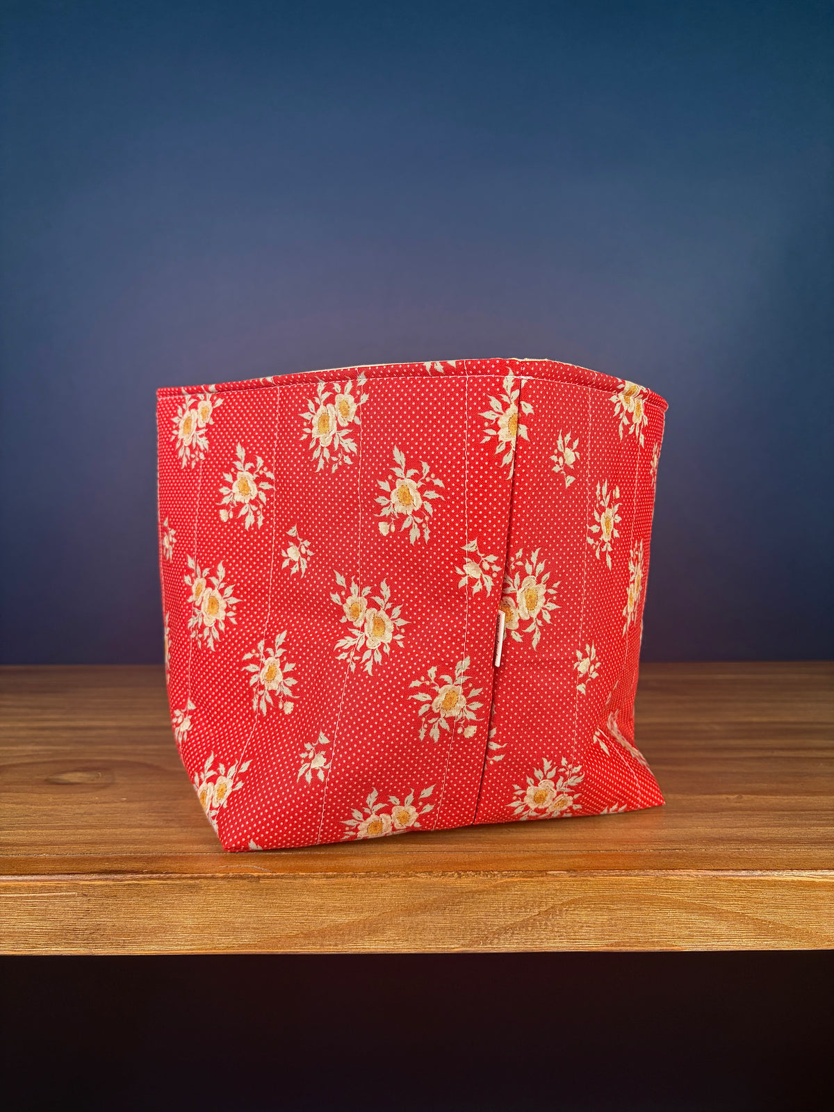 Large fabric bowl, red floral fabric, structured rounded shape with stitched rim