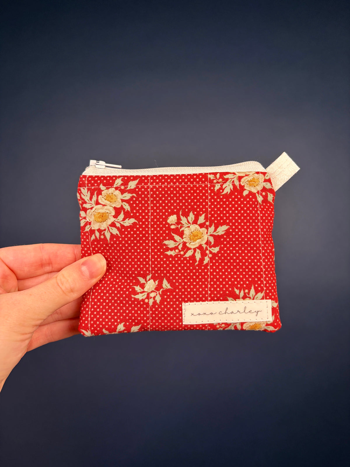 Red floral ribbon keychain zip wallet pouch with beige zipper and loop