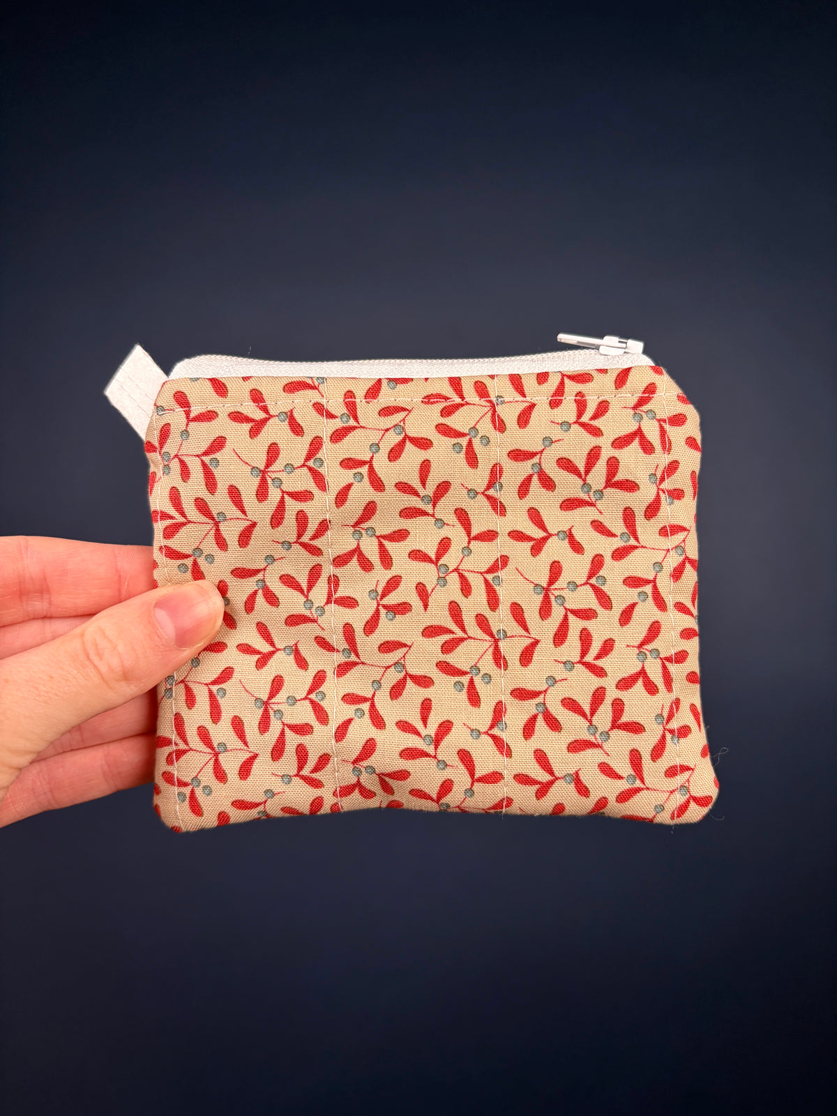 Red and cream leaf-pattern keychain wallet pouch with metal zipper pull