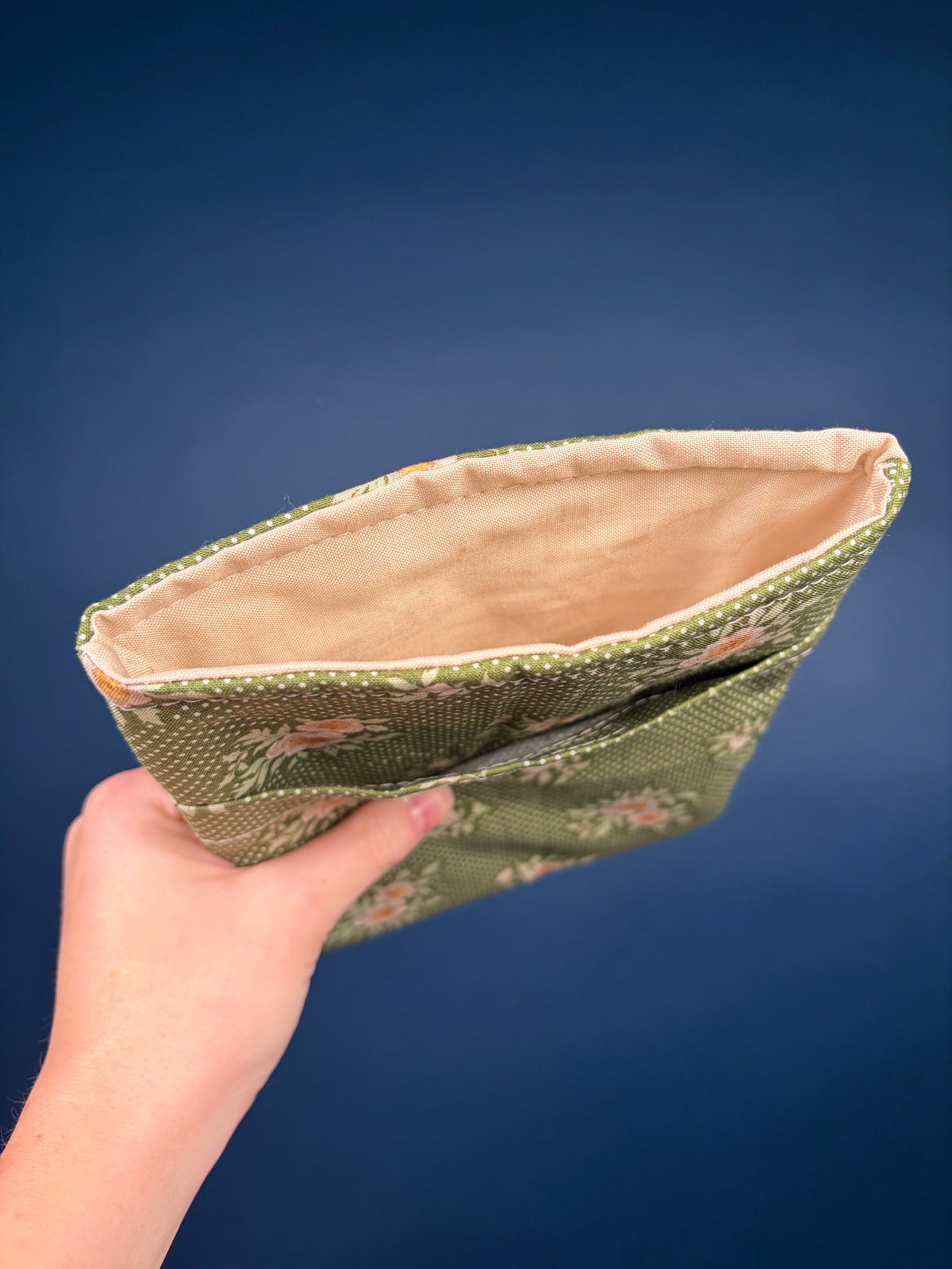 E-reader sleeve interior with light lining and floral outer fabric edge