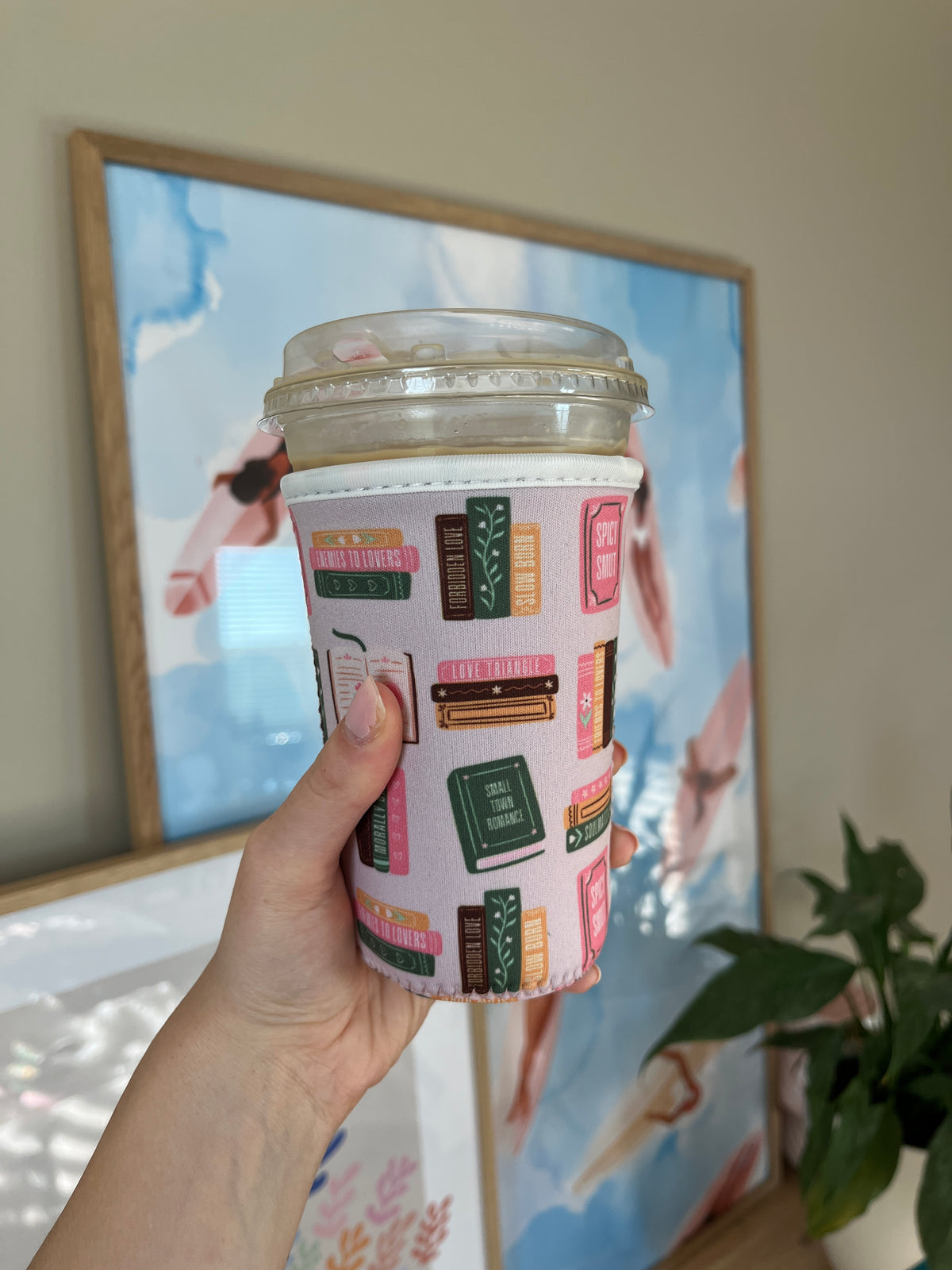 Book-spine printed cup sleeve with colorful red and green design