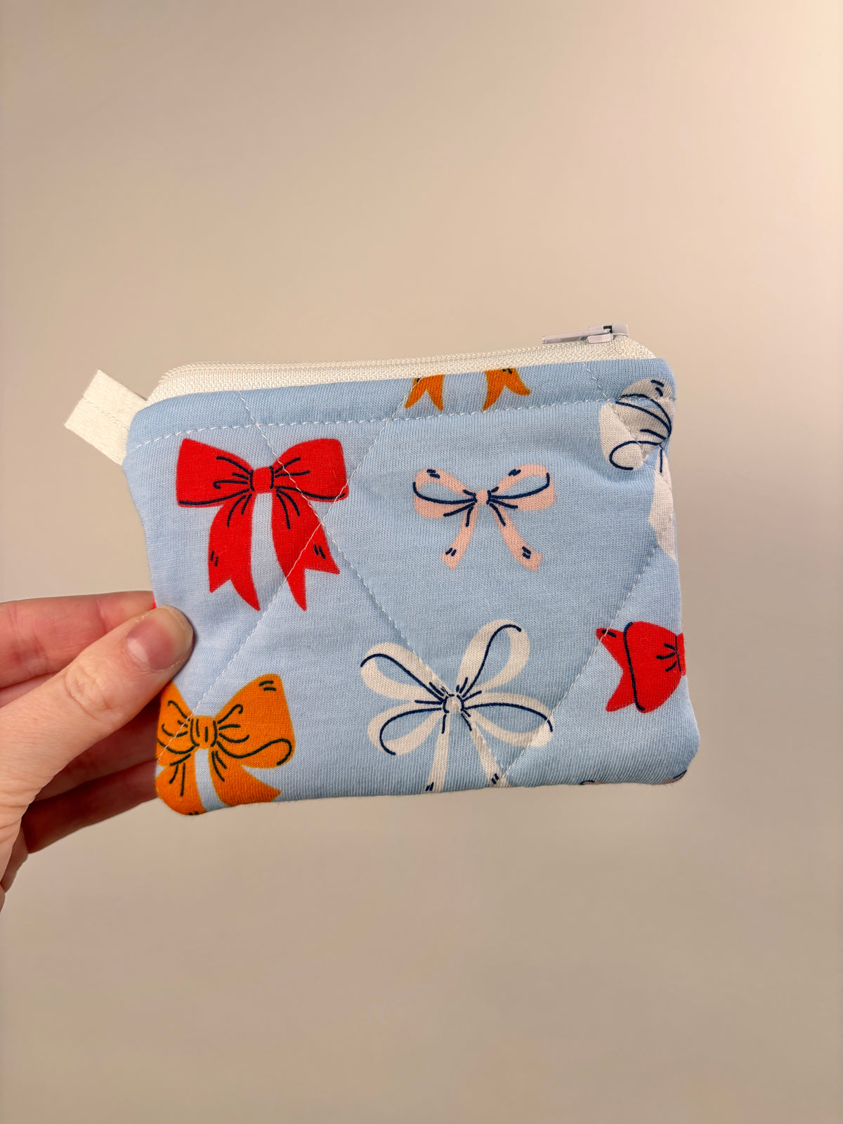 Light blue bow print zip pouch wallet with cat and ribbon motifs