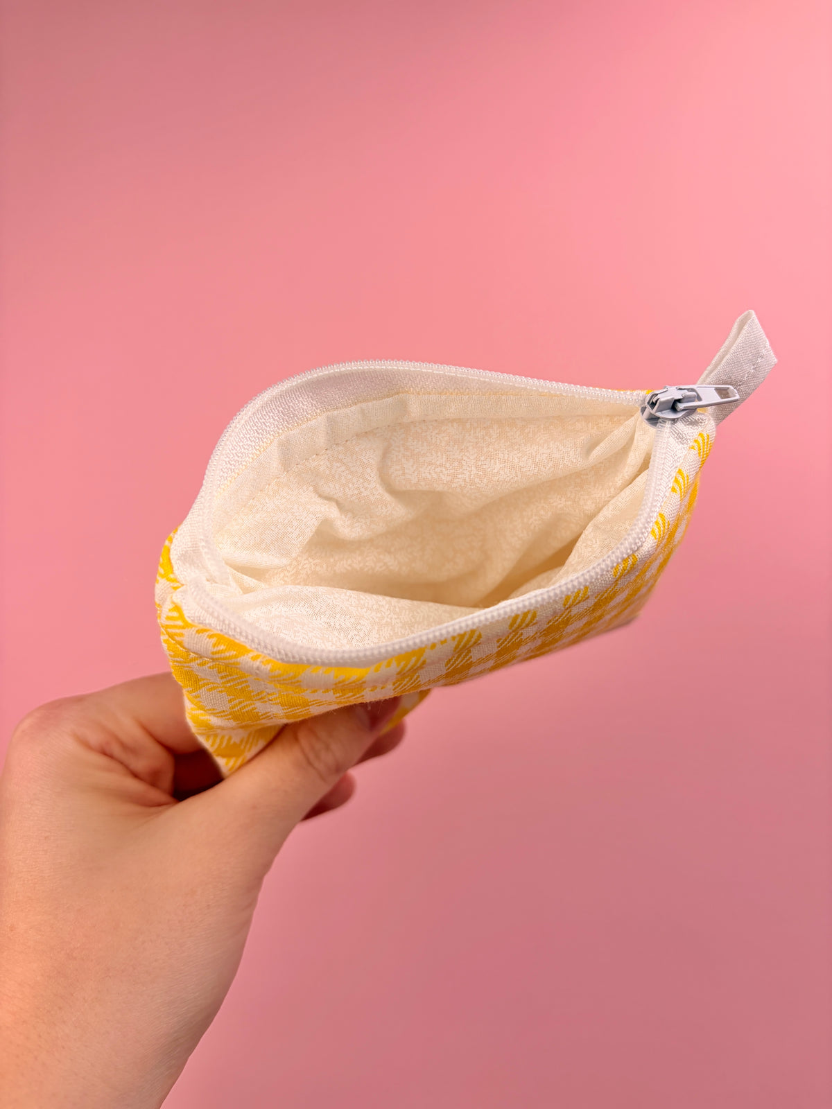 Yellow gingham zip pouch wallet open view showing light interior lining