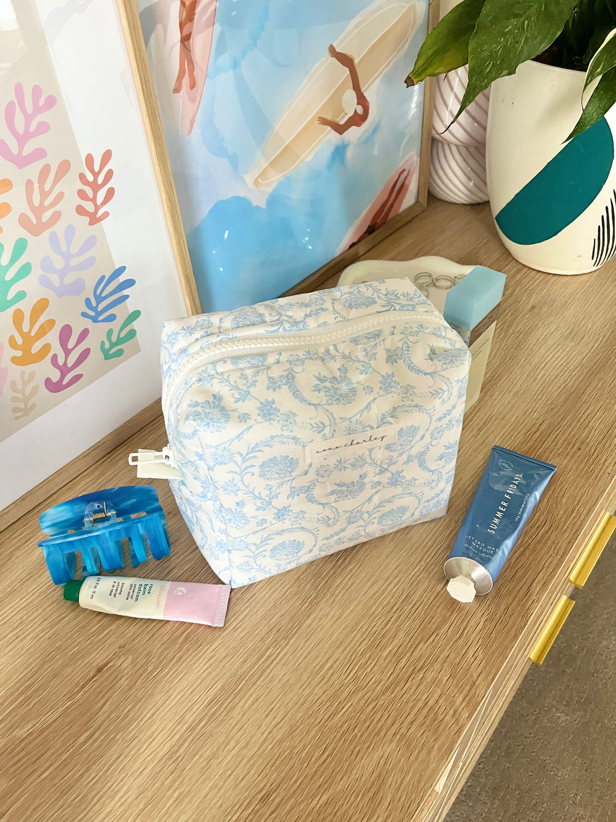Light blue floral medium makeup bag with zipper closure