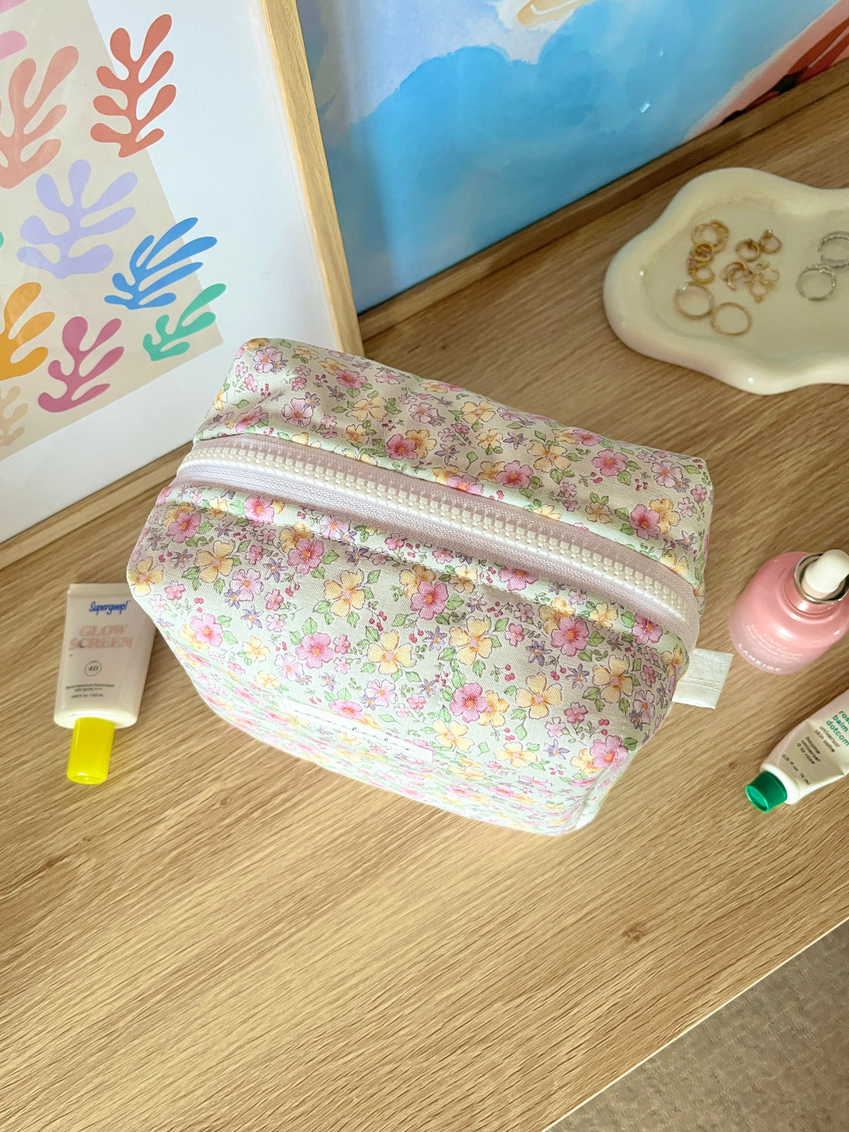 Primrose medium makeup bag in floral print with striped zipper edging