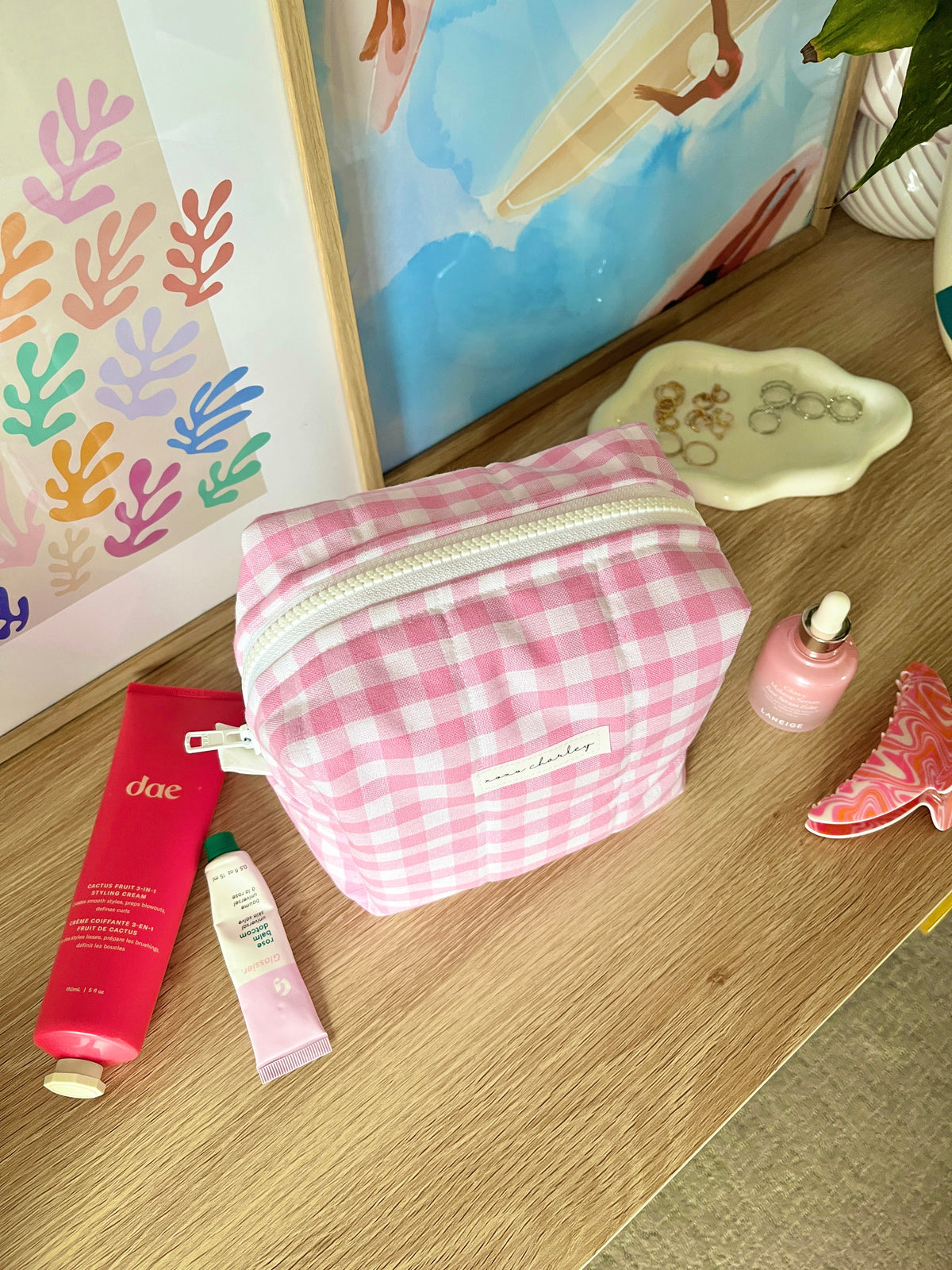 Pink gingham medium makeup bag with top zipper and white piping trim