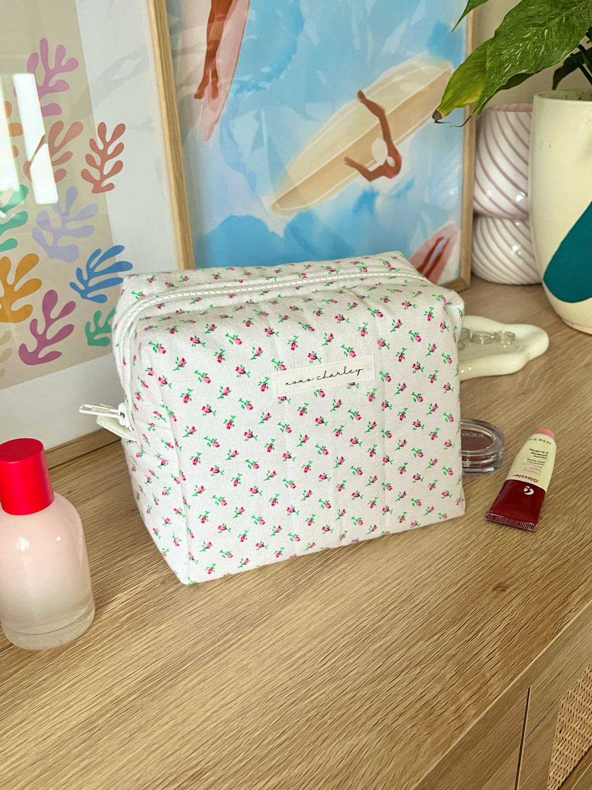 Mini rose patterned makeup bag with top zipper, white canvas with small green and pink flowers