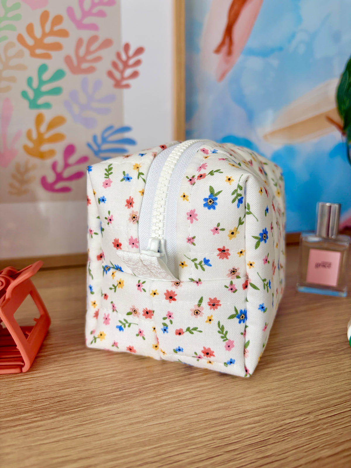Mini floral makeup bag with curved top and white zipper