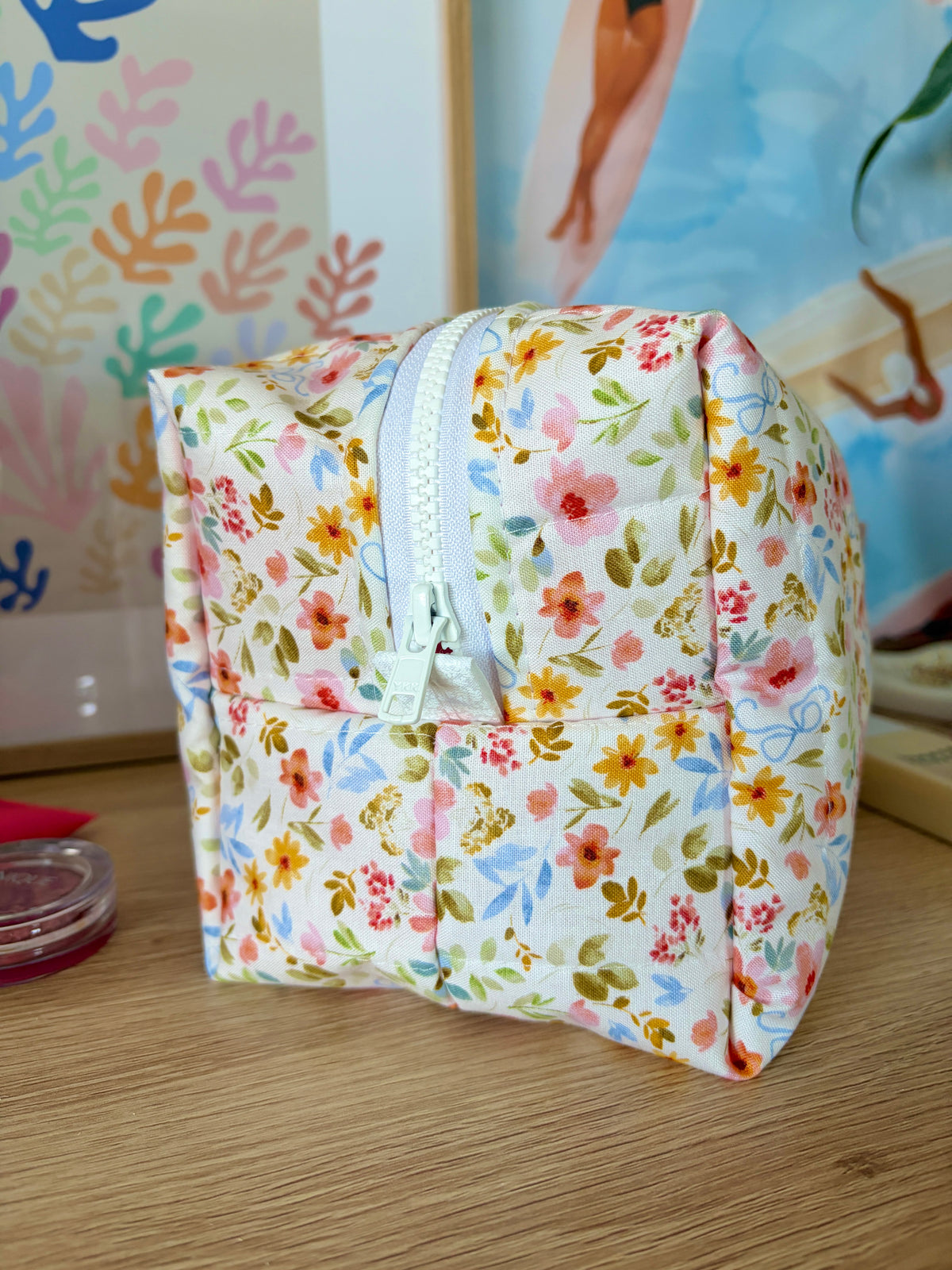 Floral large makeup bag with white floral print and light blue zipper trim
