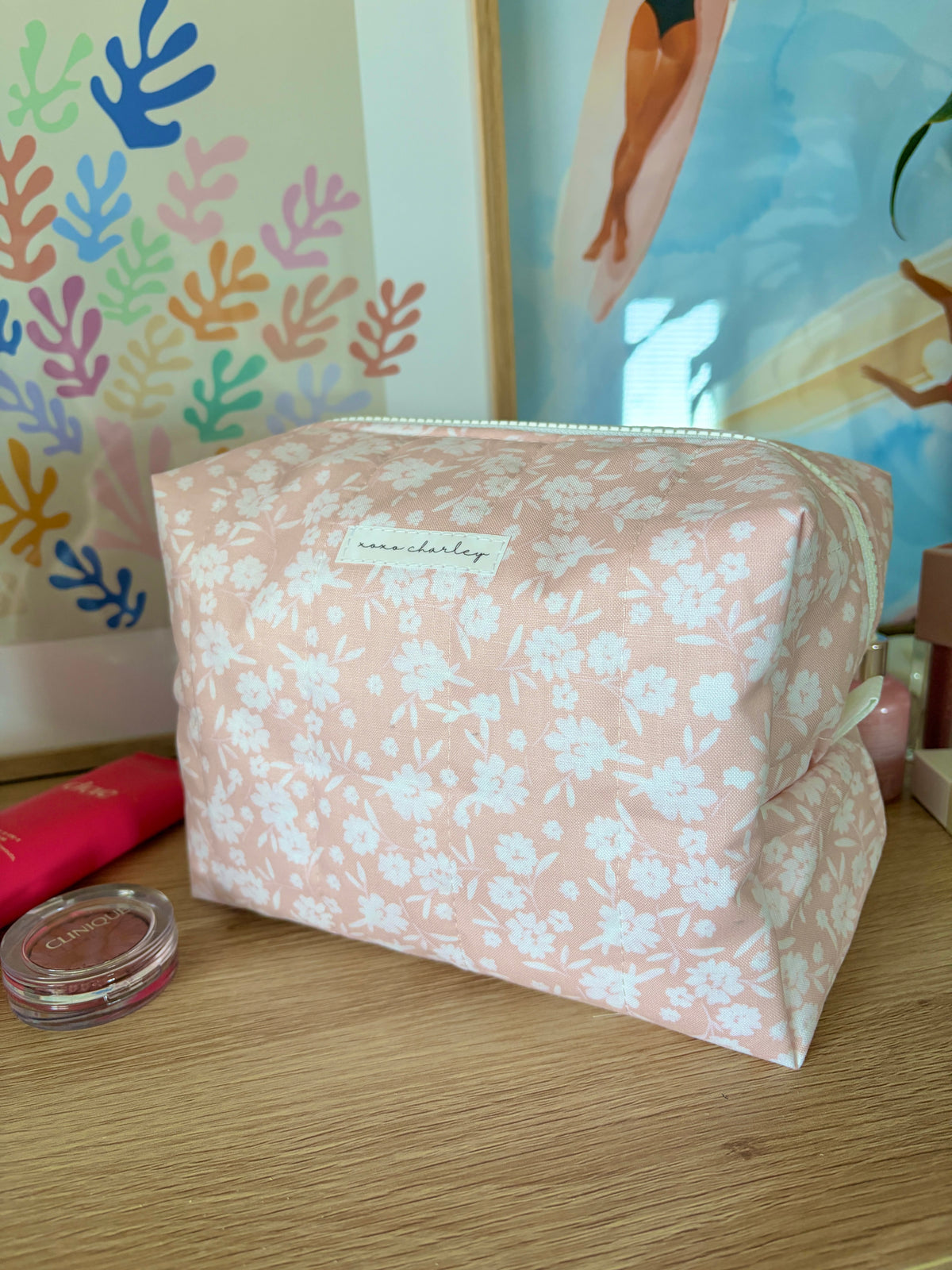 Light pink floral makeup bag with mint zipper and rectangular silhouette