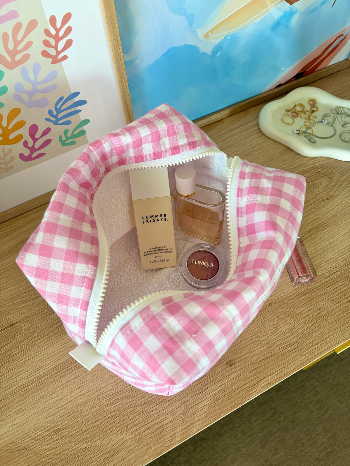 Pink gingham large makeup bag with white zipper, open view showing the interior