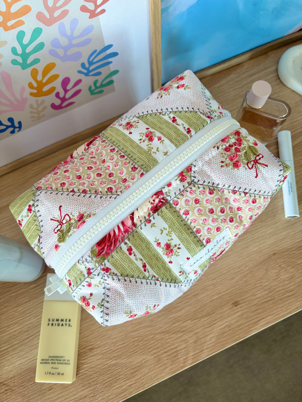 Large floral patchwork makeup bag with turquoise zipper trim and front panel