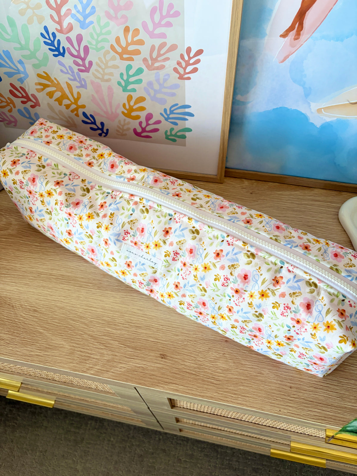 Floral hair tools bag with white zipper trim, large rectangular pouch.