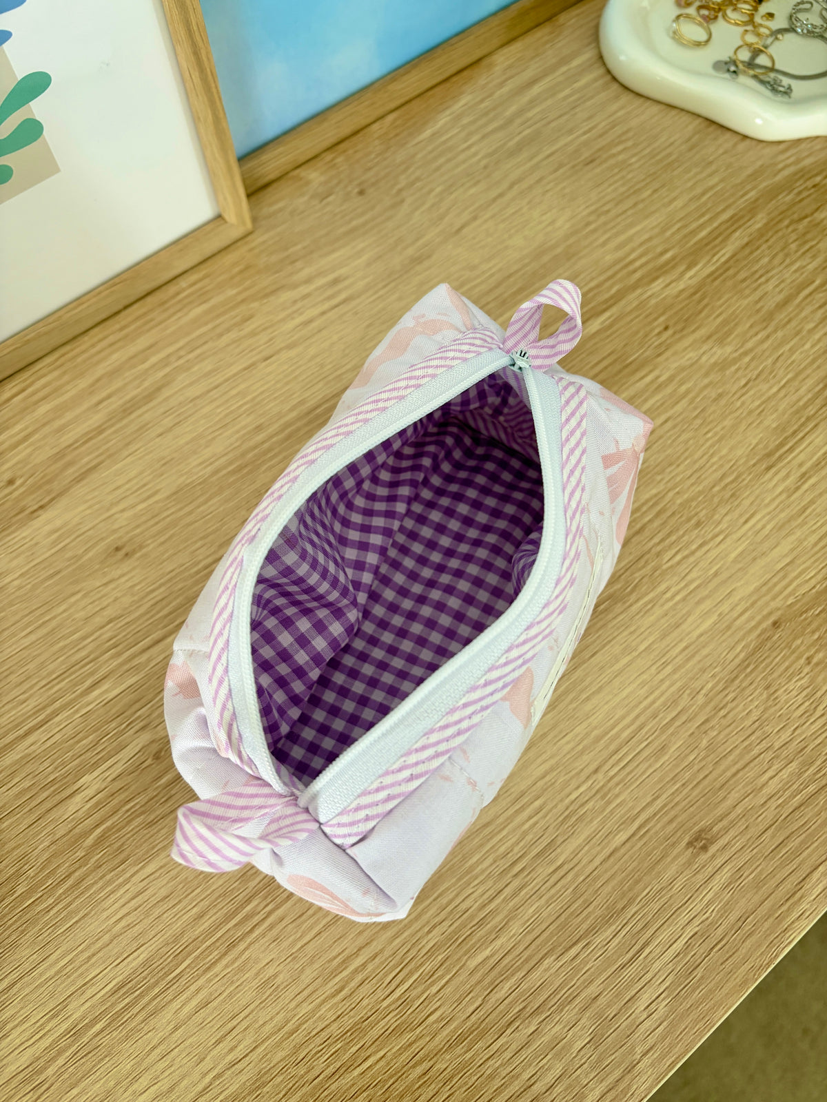 Pink bow colorblock bag with purple gingham lining and striped zipper trim