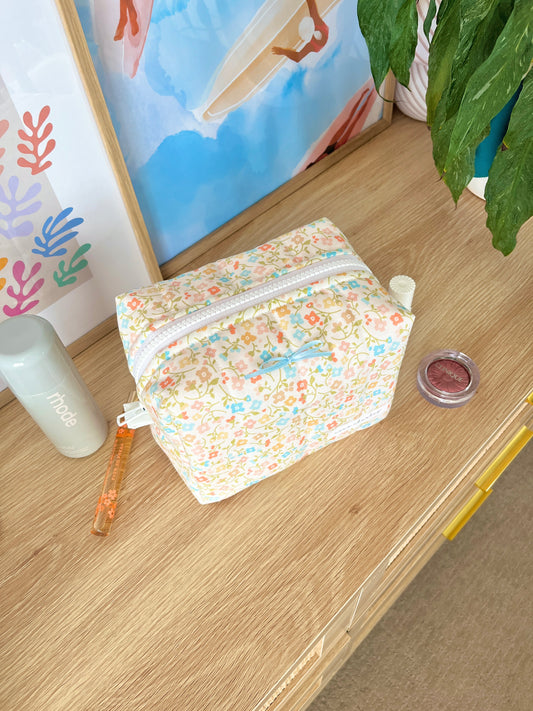 The Hailey Makeup Bag with blue bow