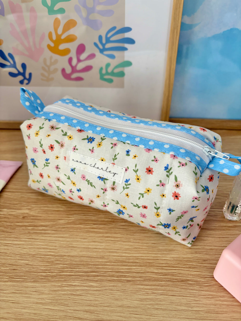 Mini floral zip pouch with blue gingham trim, open view showing fabric lining