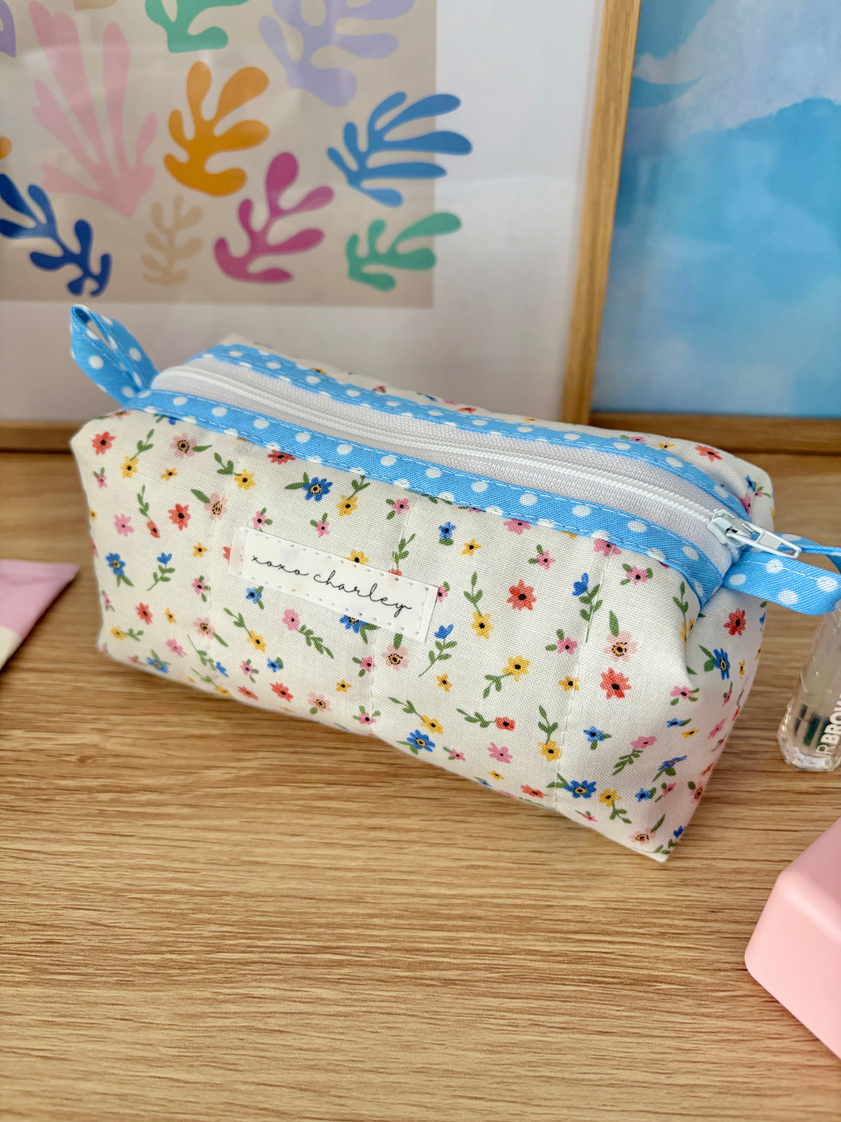 Mini floral zip pouch with blue gingham trim, open view showing fabric lining