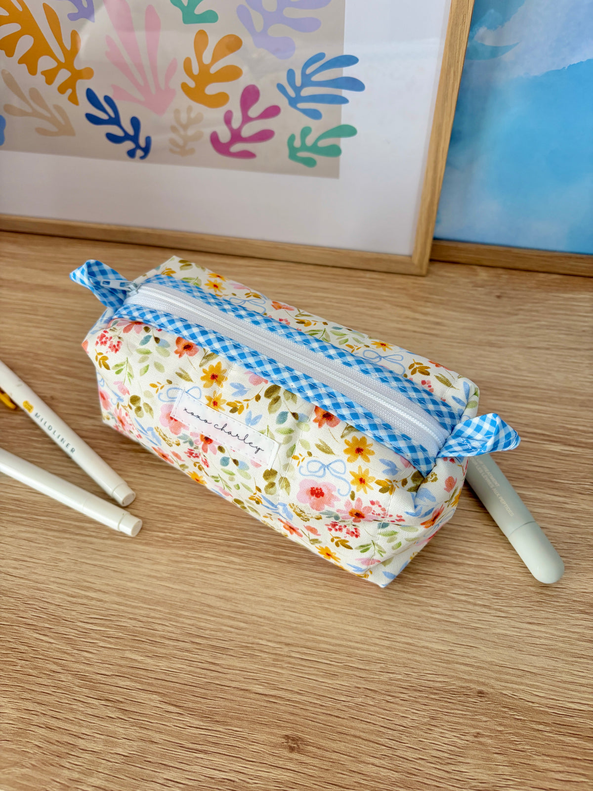 Floral colorblock zip bag with blue gingham trim and flower print