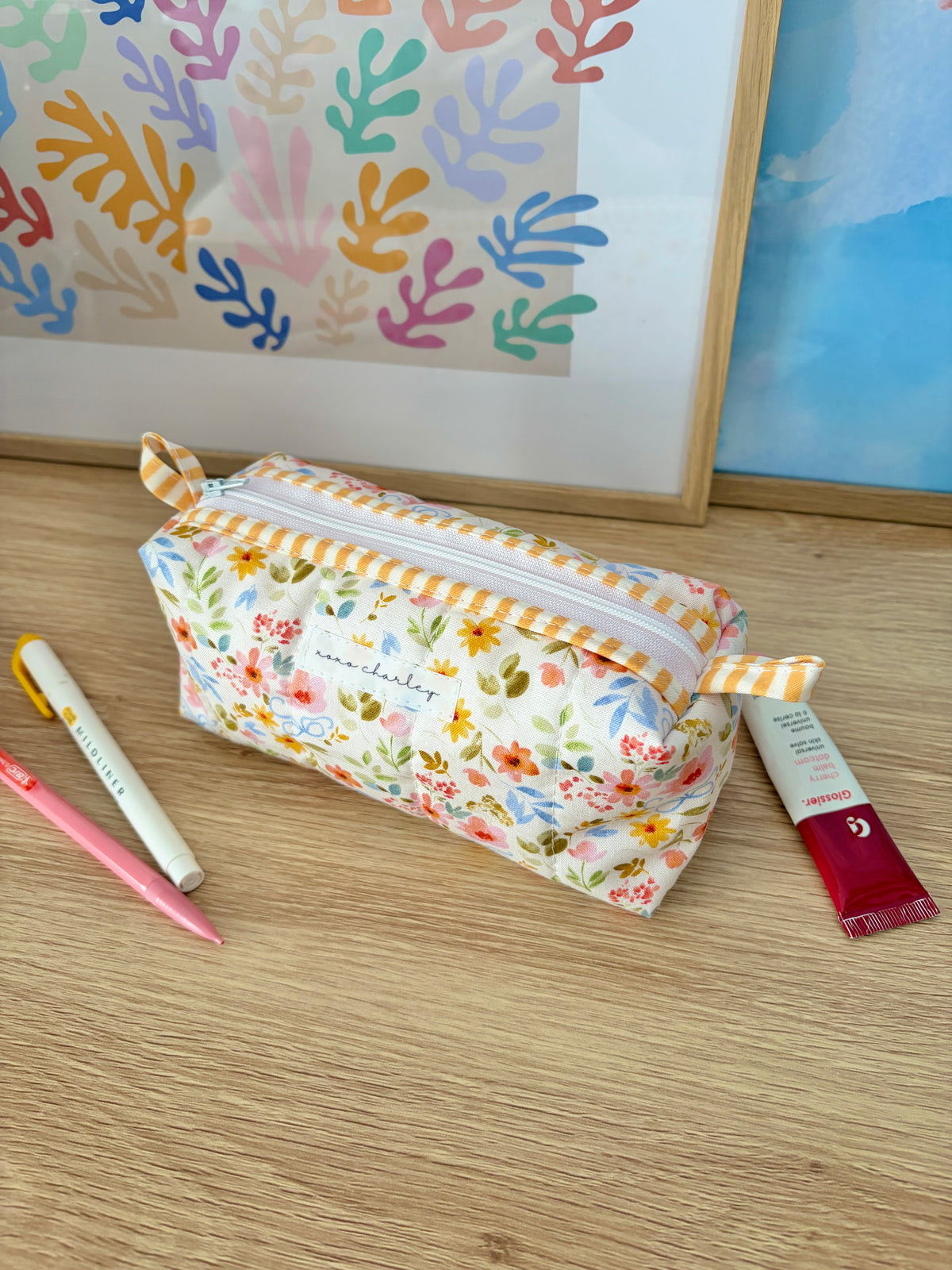Floral colorblock zip pouch with yellow stripe trim and pink gingham lining