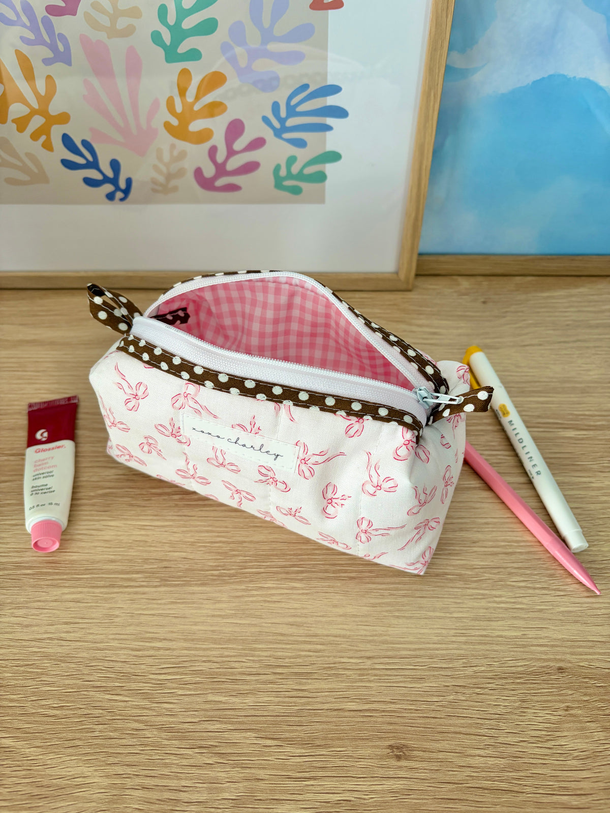 Mini bow-print zip pouch bag with pink gingham interior and brown polka-dot trim