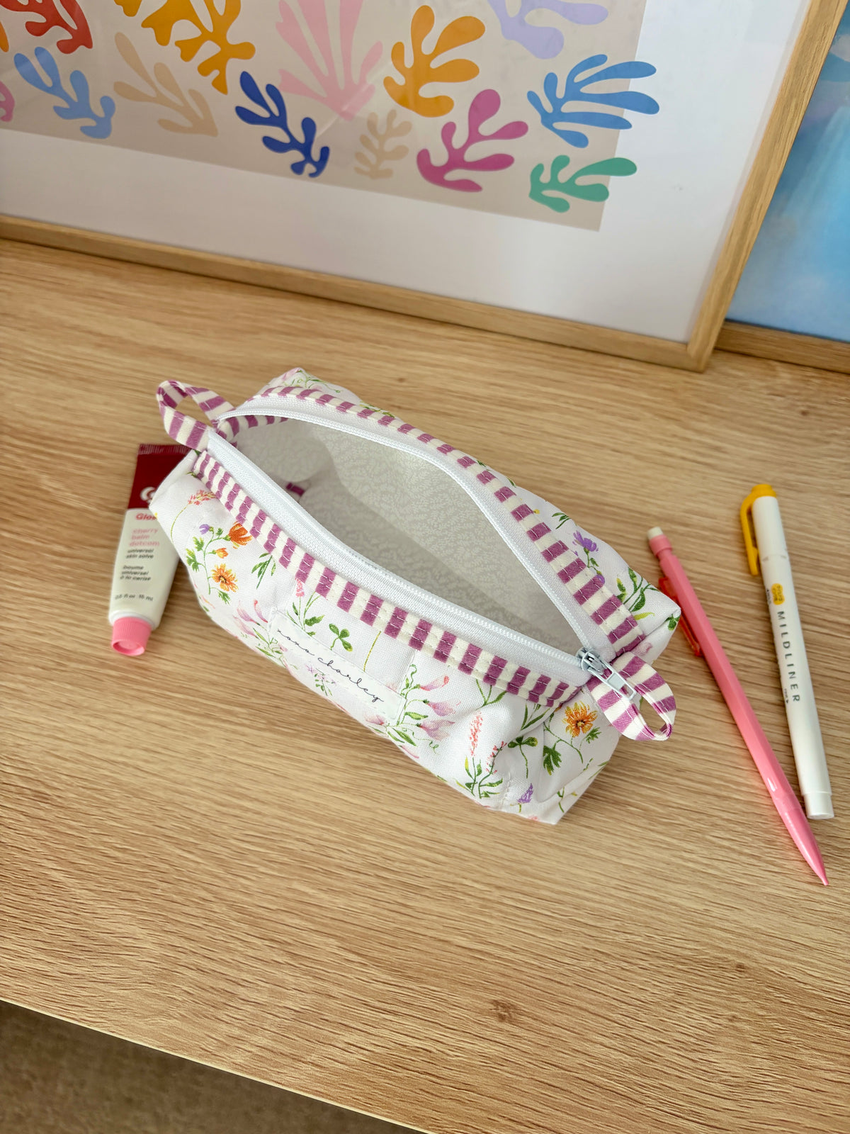 Wildflower fabric pencil pouch with purple gingham trim, zipper closure
