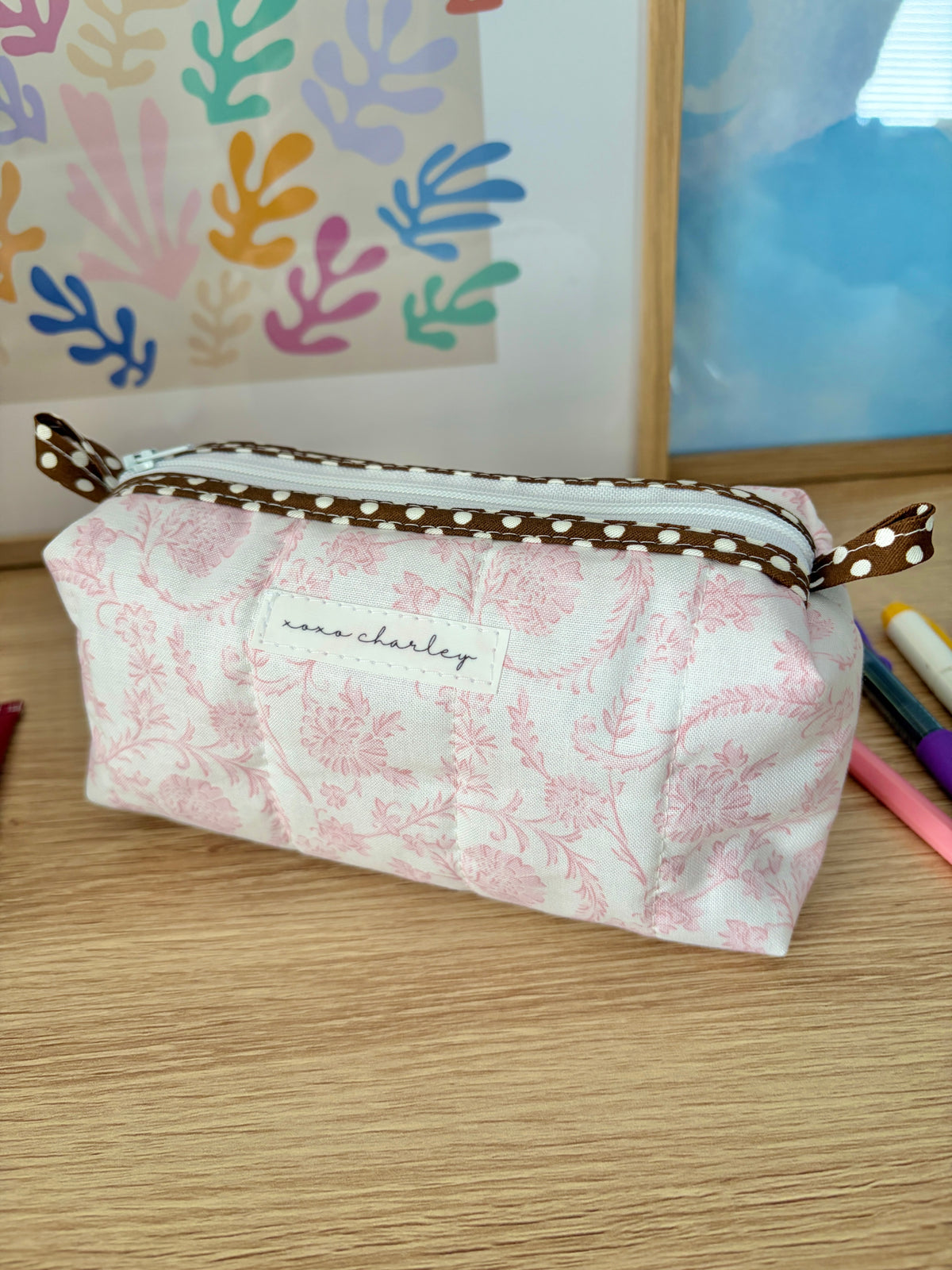 Pink floral vintage bag with brown polka-dot edge and top carry handles
