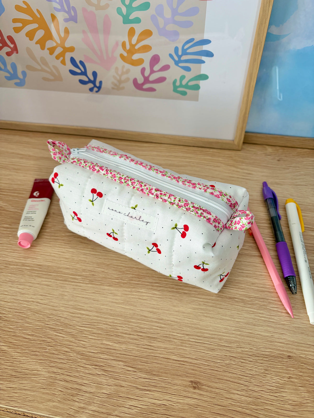 Cherry red colorblock zip pouch bag with red cherry print and pink trim, green gingham lining