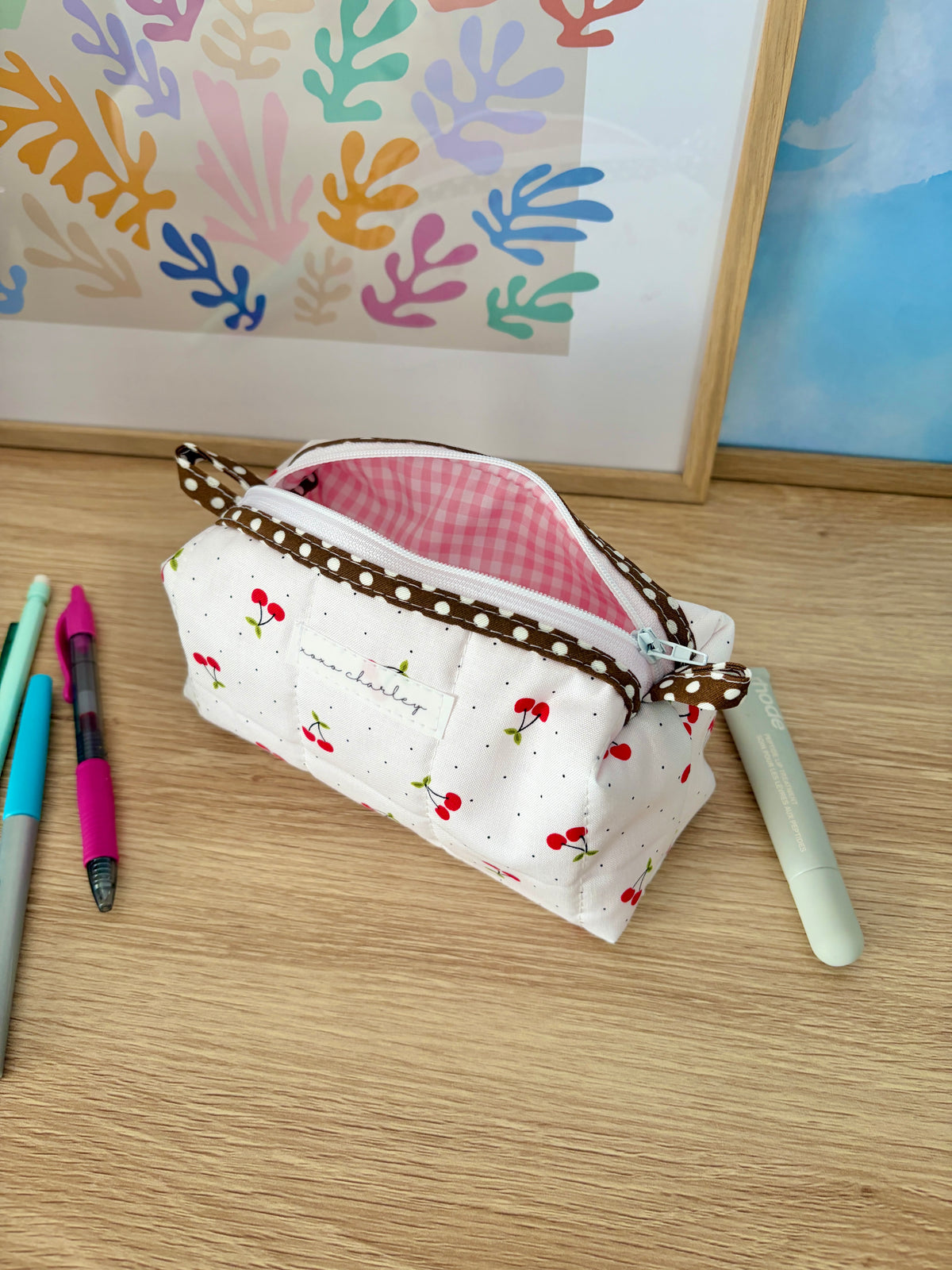 Cherry print white zip pouch with brown trim and pink gingham lining