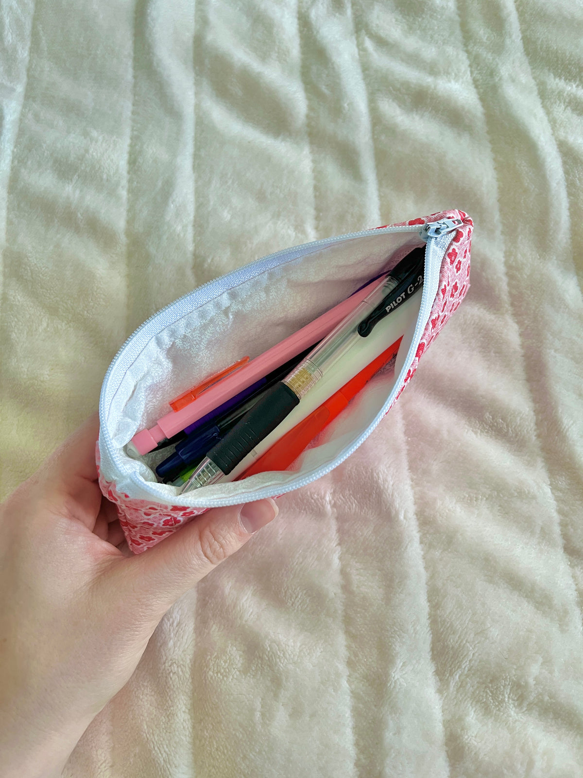 Pink floral pencil and glasses case, zip-top open with interior lining visible