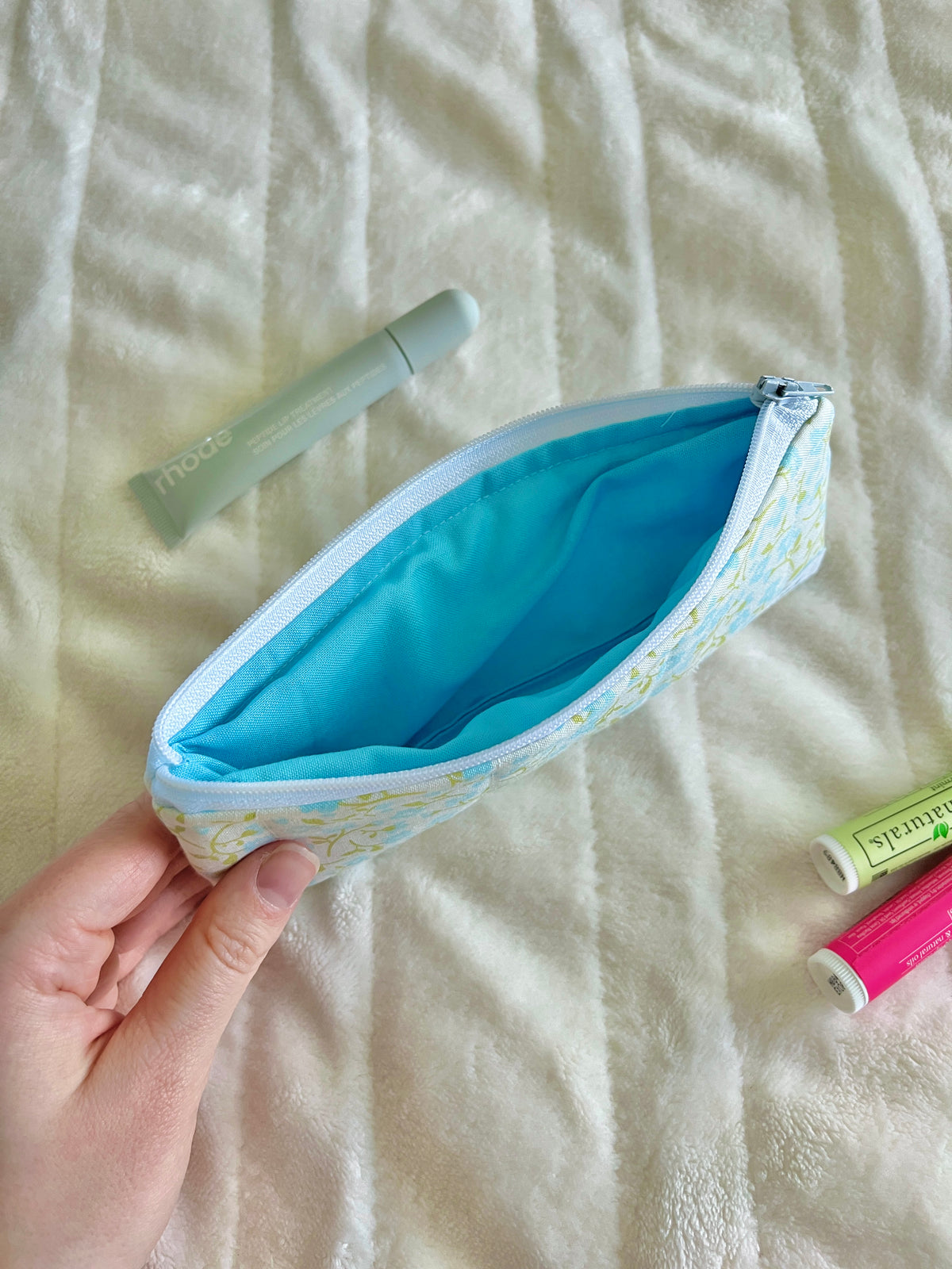 Floral pencil and glasses case with blue zipper, open turquoise lining