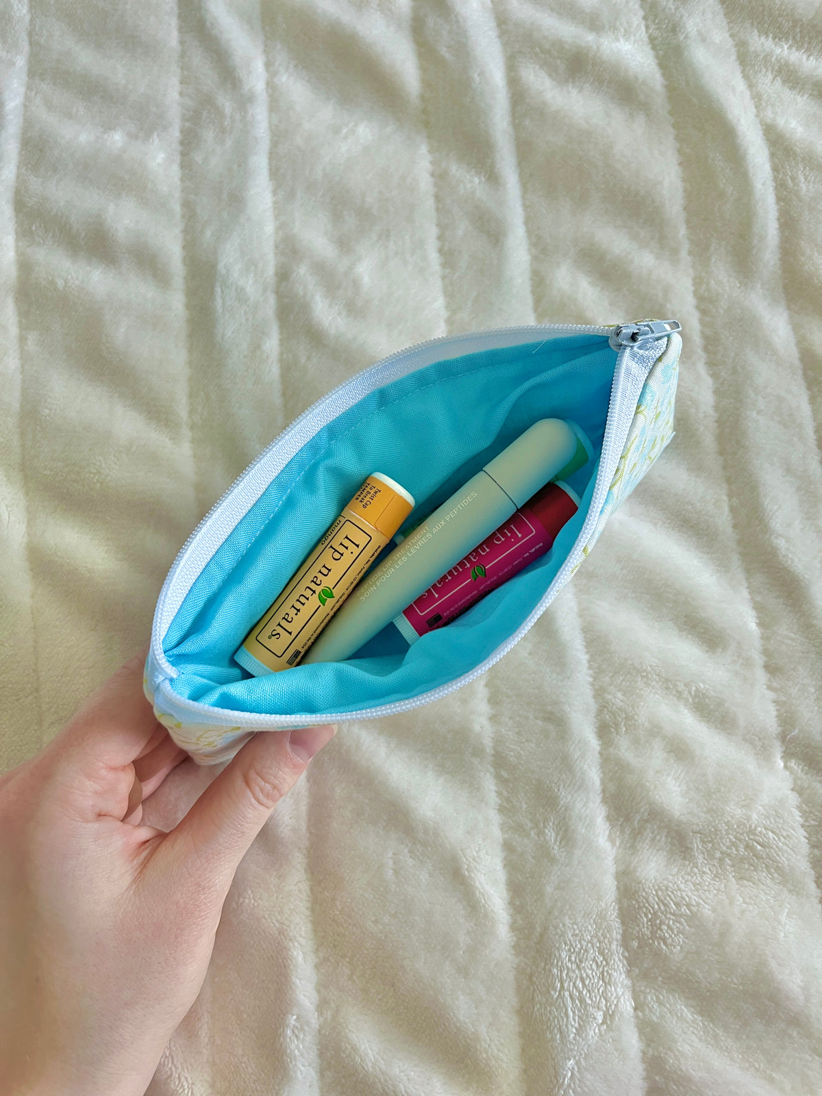 Floral pencil and glasses case pouch, open with colored pencils and turquoise lining