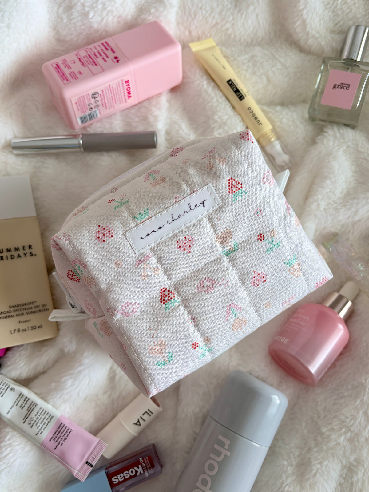 Pixel Picnic mini makeup bag with white fabric and multicolor pixel pattern, front view