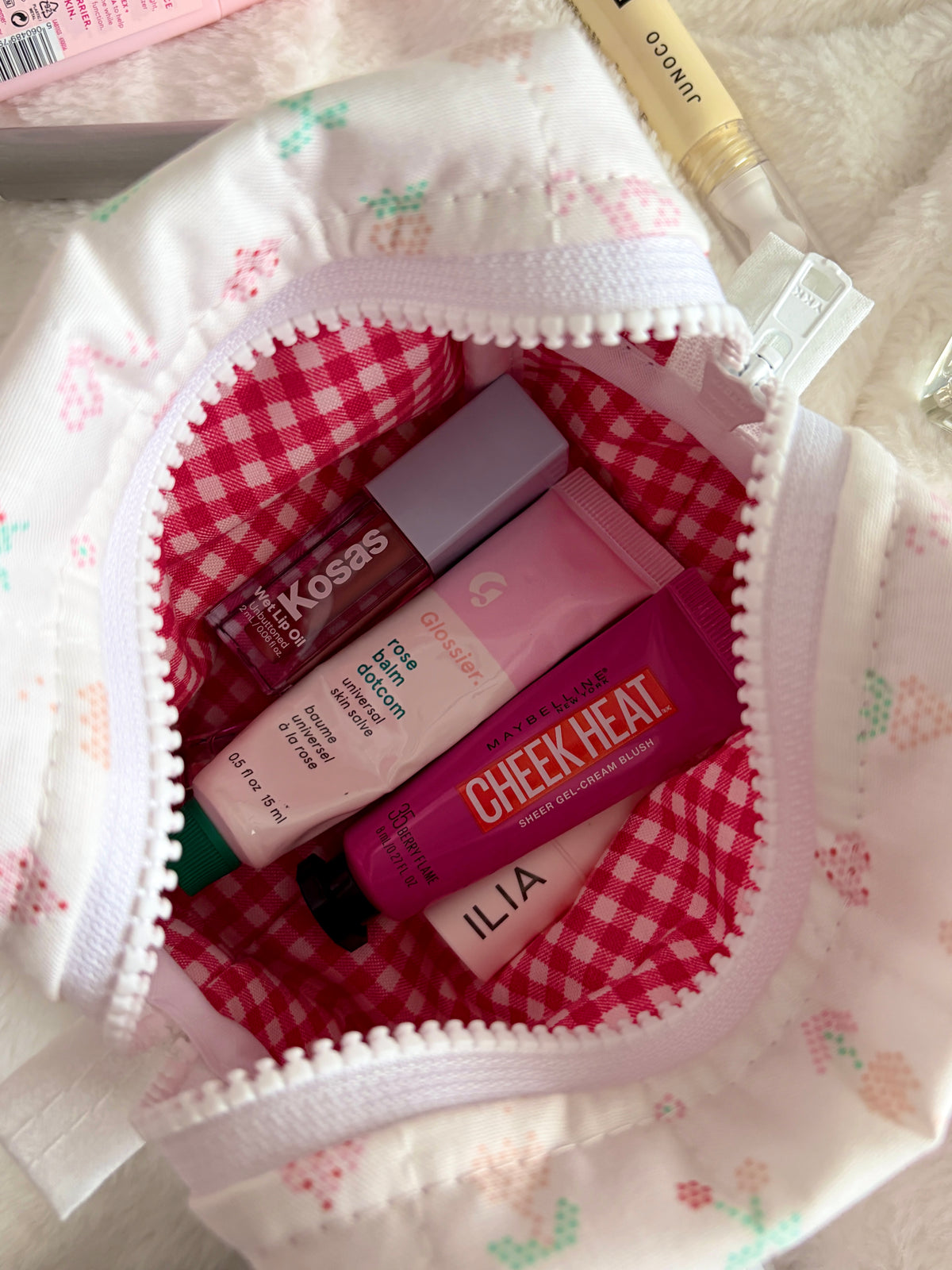 Pixel Picnic mini makeup bag open with red gingham interior, showing inside compartments