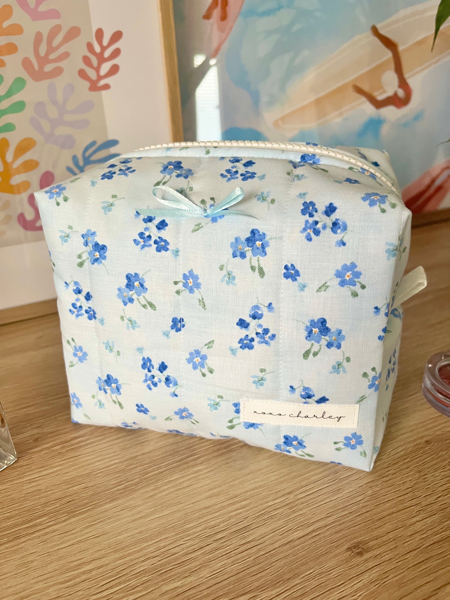 The Evelyn Makeup Bag with blue bow