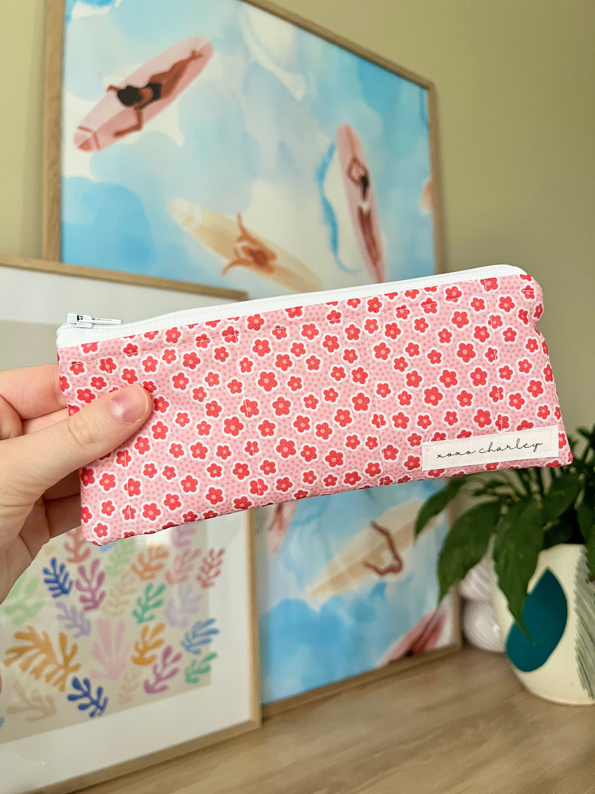 Pink floral pencil and glasses case with zipper, held closed