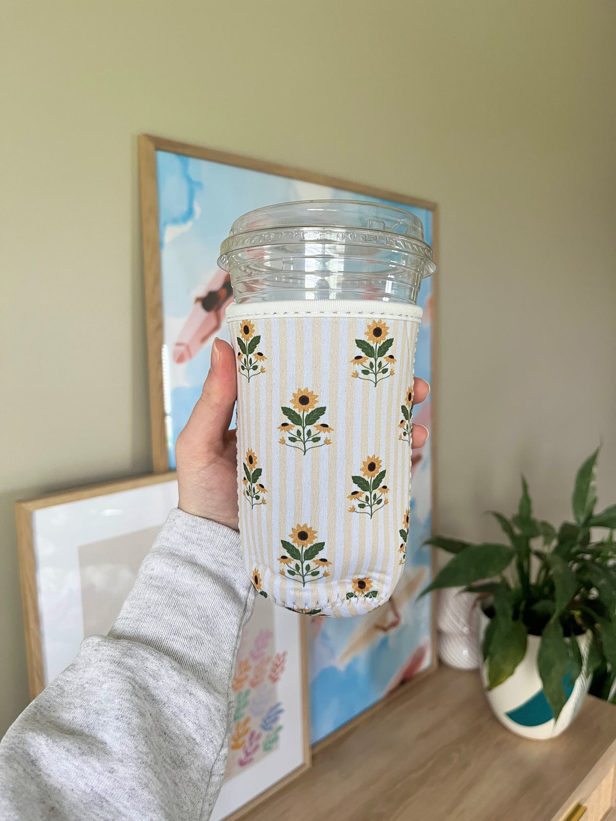 Sunflower cup sleeve, vertical stripe design with yellow blooms on clear tumbler