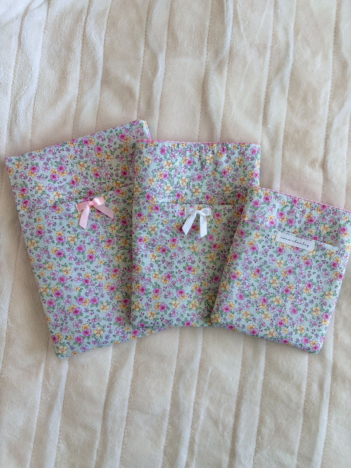 Floral e-reader/book sleeve, folded sections, small white ribbon bows