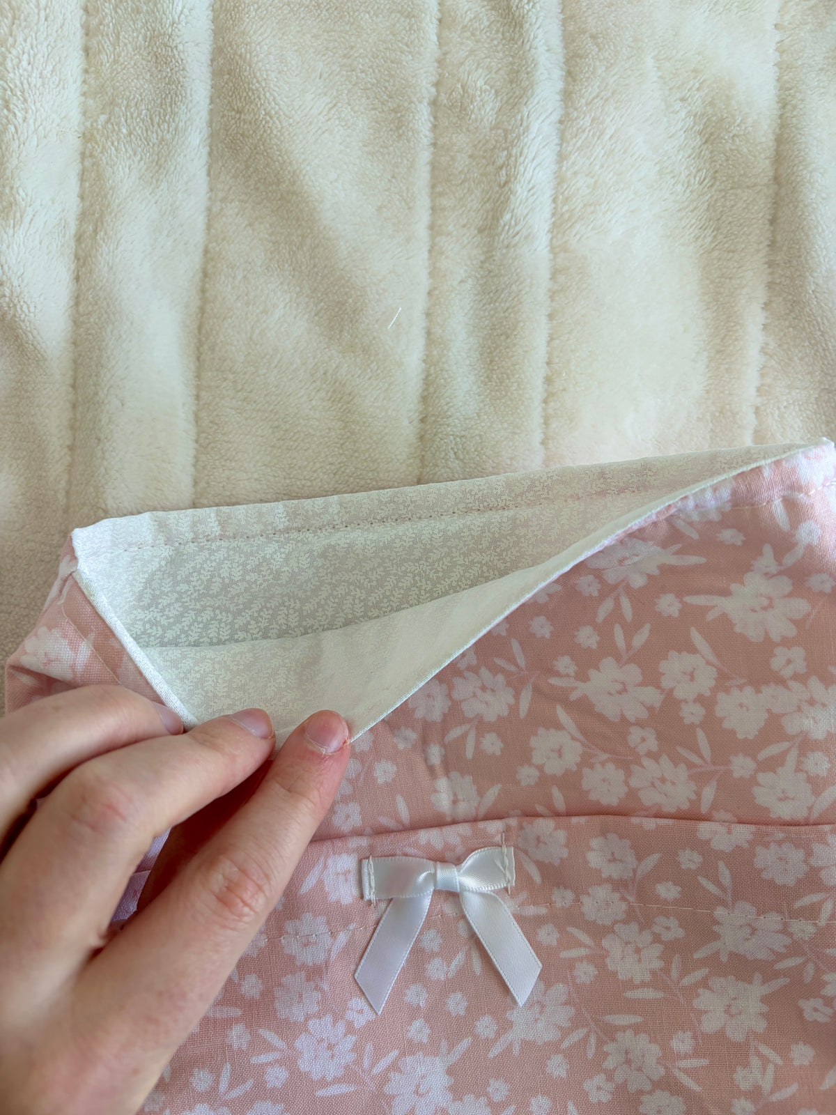Floral ballerina e-reader/book sleeve with pale pink floral exterior and white bow detail