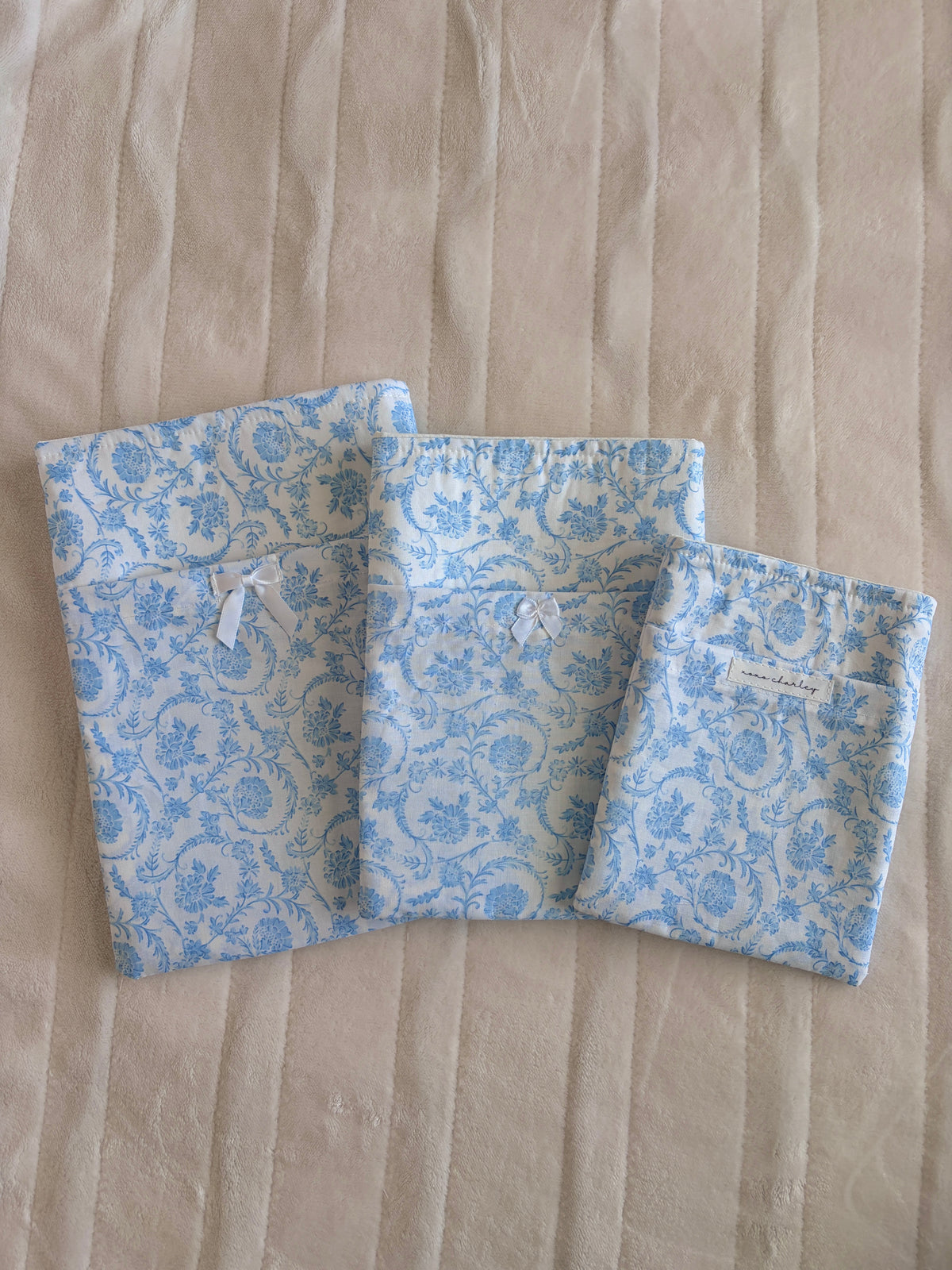 Blue floral e-reader and book sleeve with open pocket panels