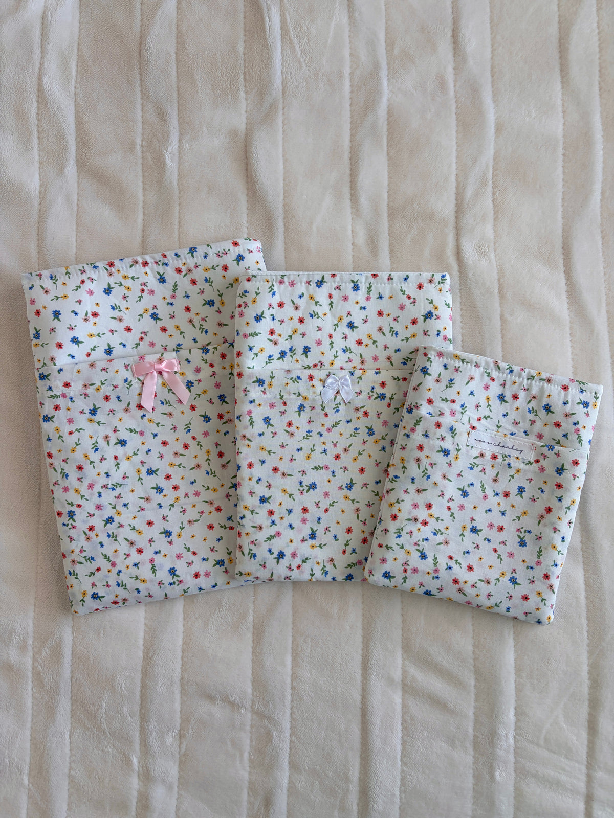 Mini floral e-reader/book sleeve with pink ribbon bow, fold-over design