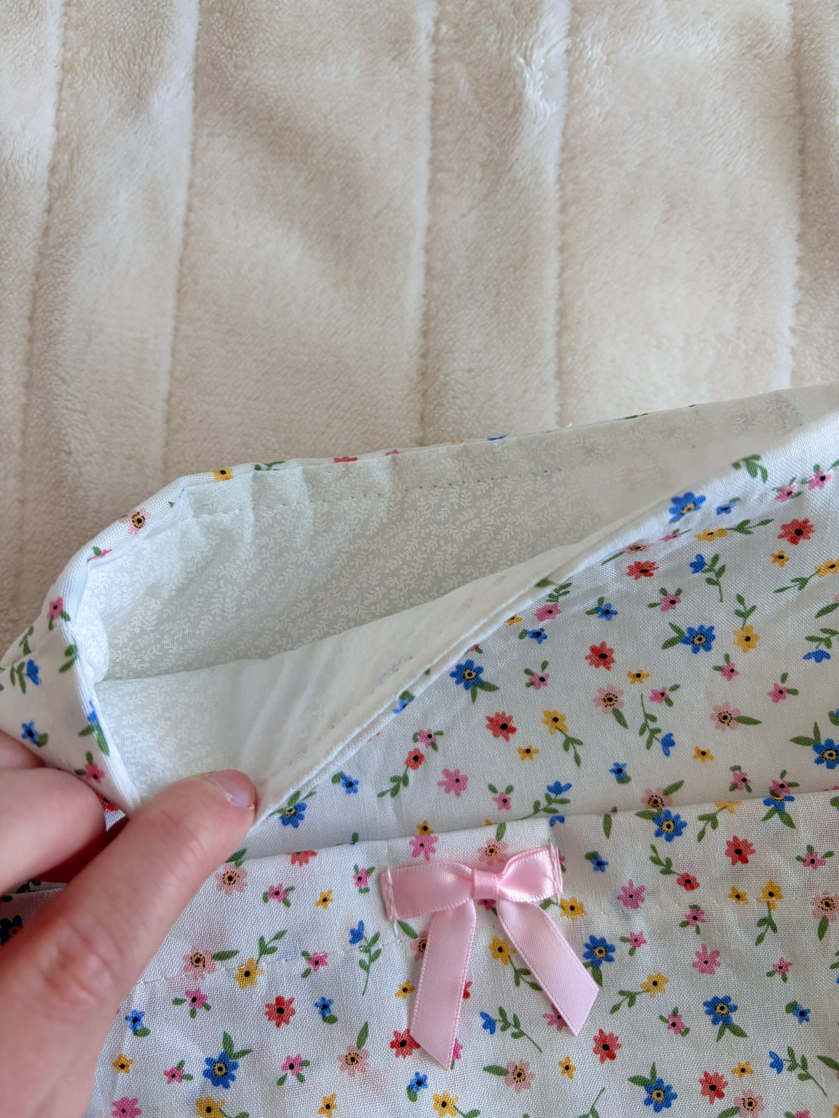 Mini floral e-reader/book sleeve with pink ribbon bow detail, fold-over opening