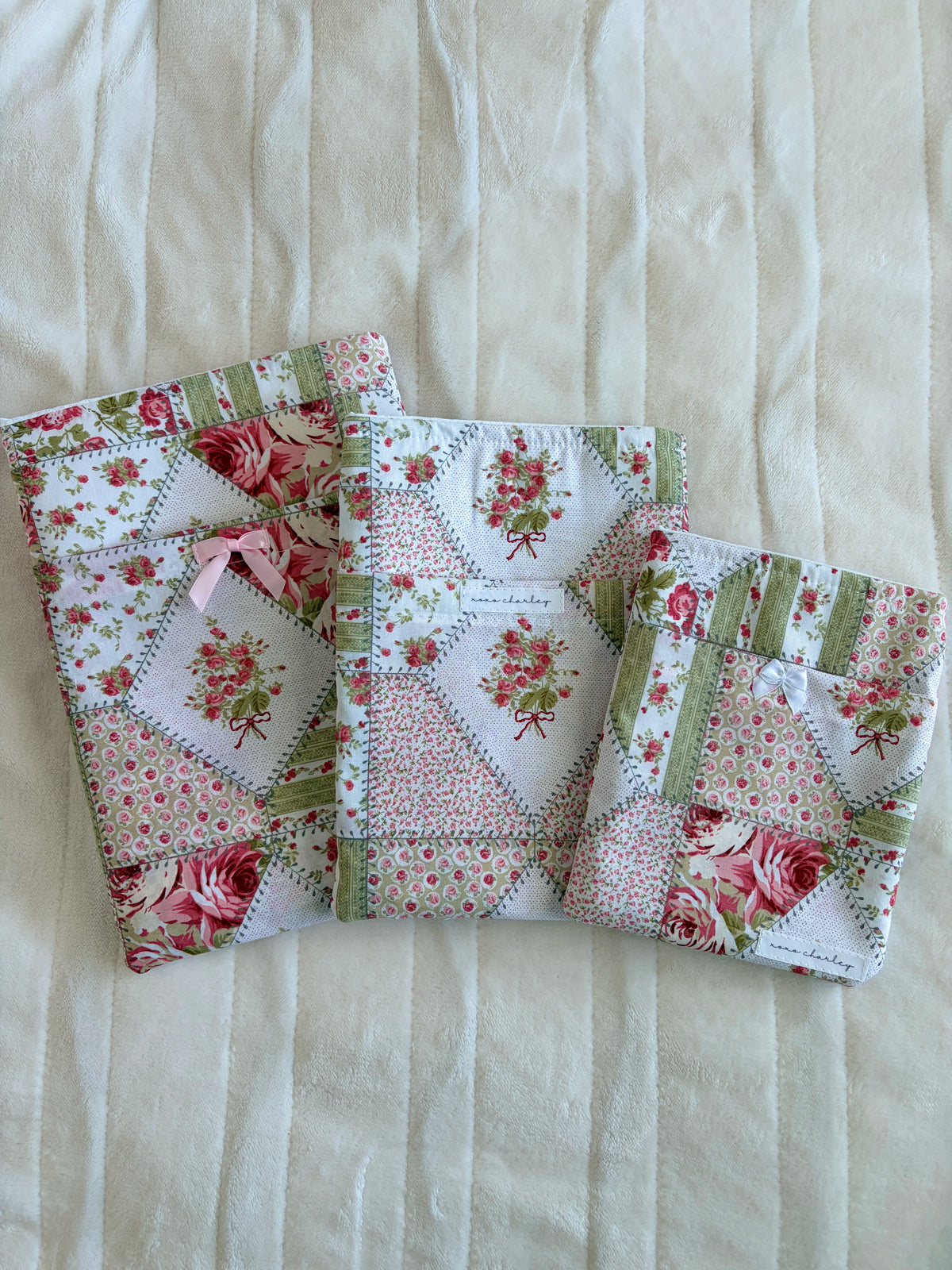 Floral patchwork e-reader book sleeve with pink and white rosette bow accents