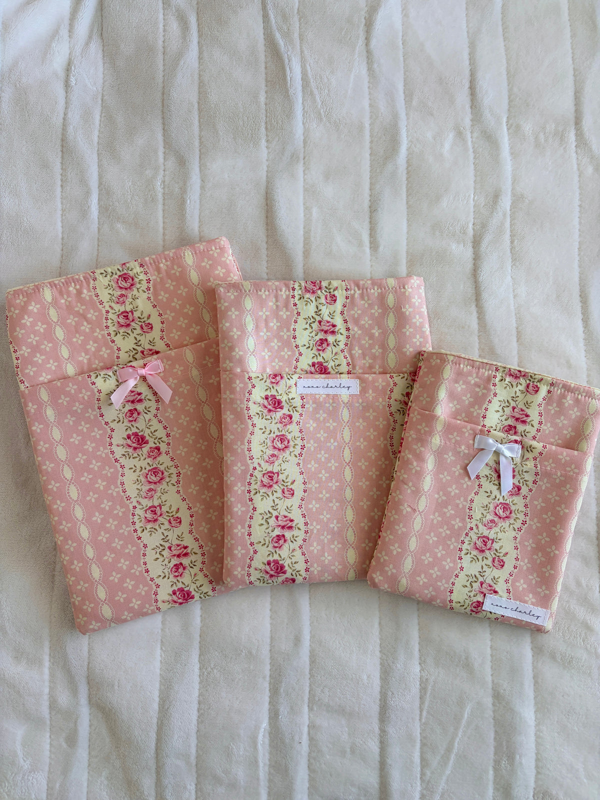 Floral e-reader/book sleeve, light pink with rose pattern and bow closure