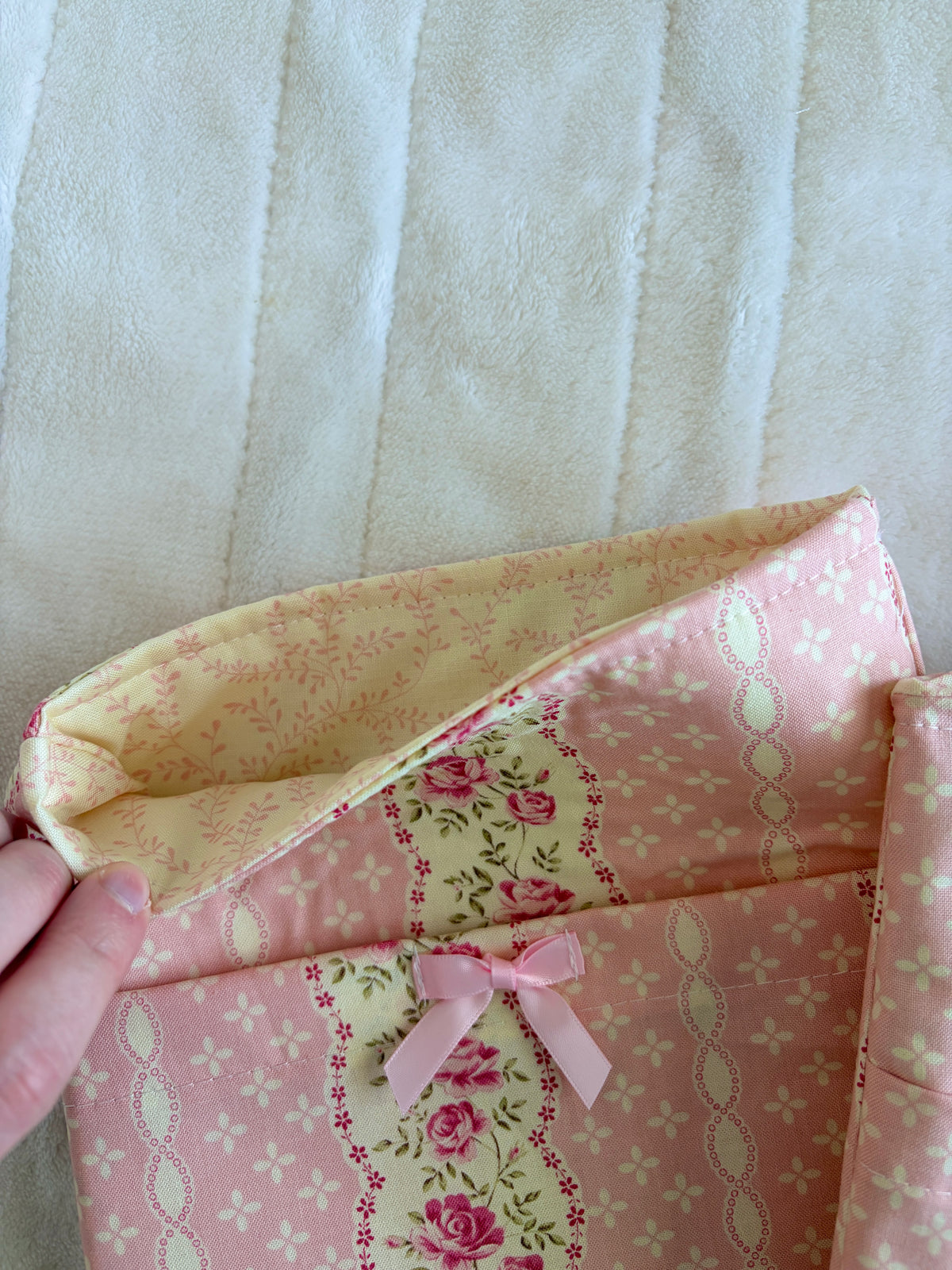 Floral e-reader sleeve, light pink with rose-and-vine print and ribbon bow